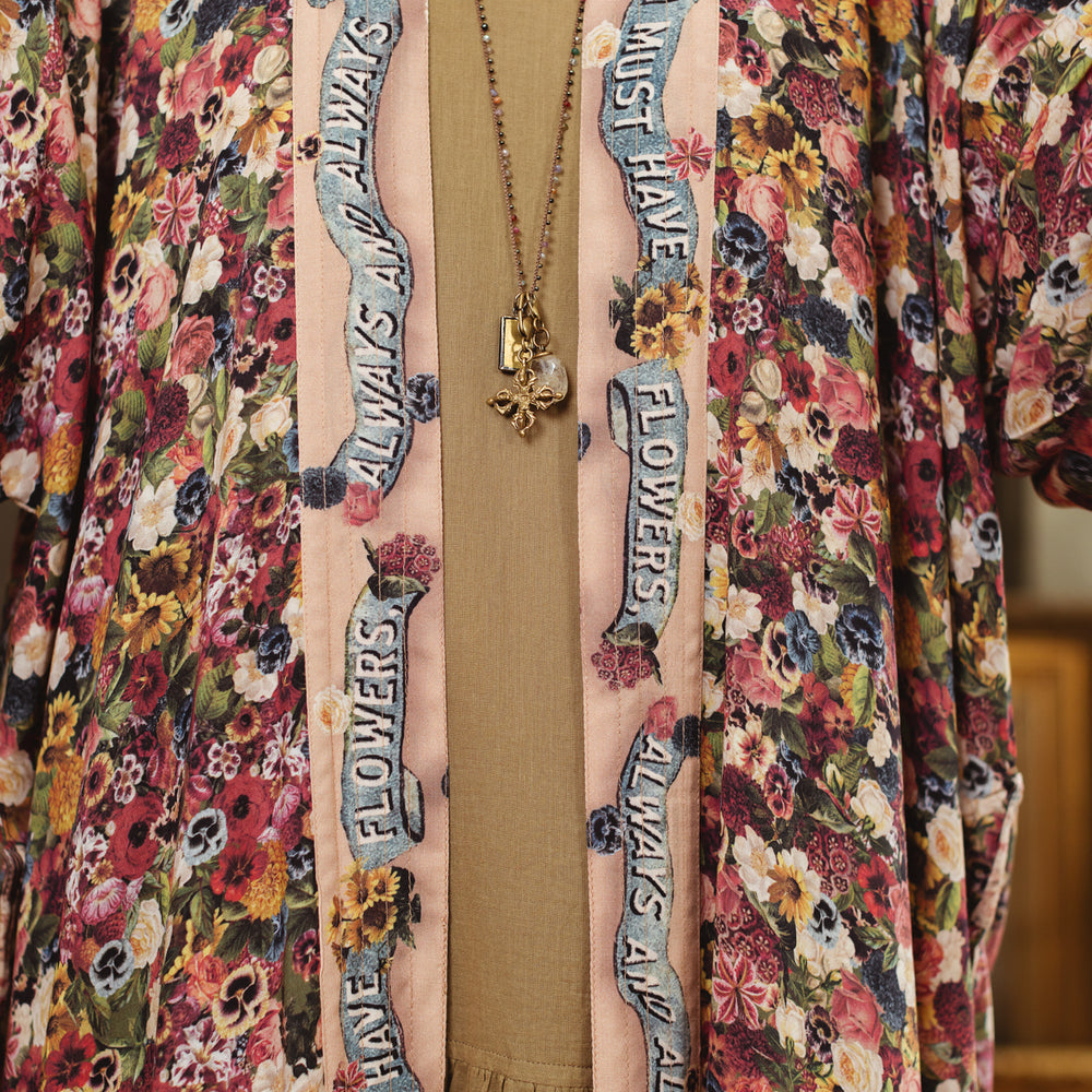 
                  
                    Opera-length kimono featuring an artist’s palette with over 50 antique seed catalogue flowers, inspired by Claude Monet’s love of flowers – Market of Stars
                  
                