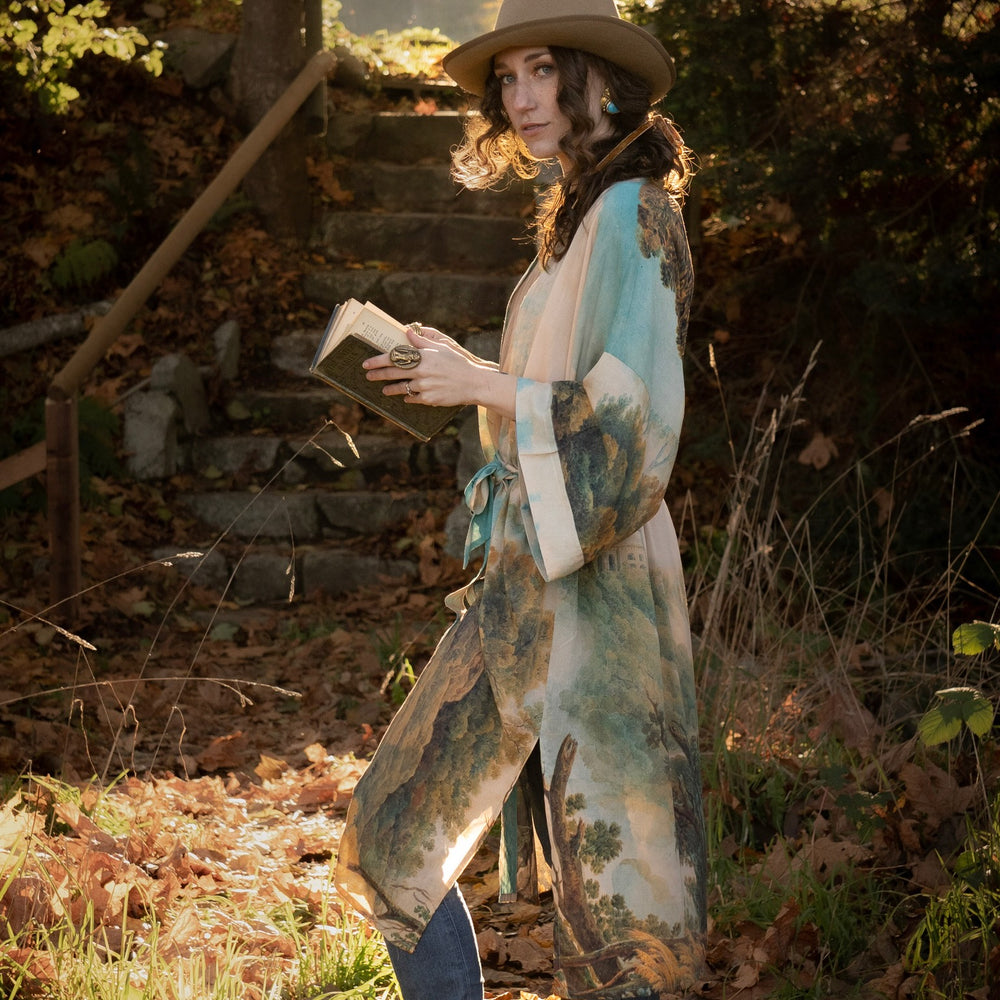 
                  
                    Romantic kimono featuring 18th-century Tivoli waterfalls and Lady Liberty art in a soft, painterly palette celebrating strength and self-love – Market of Stars.
                  
                