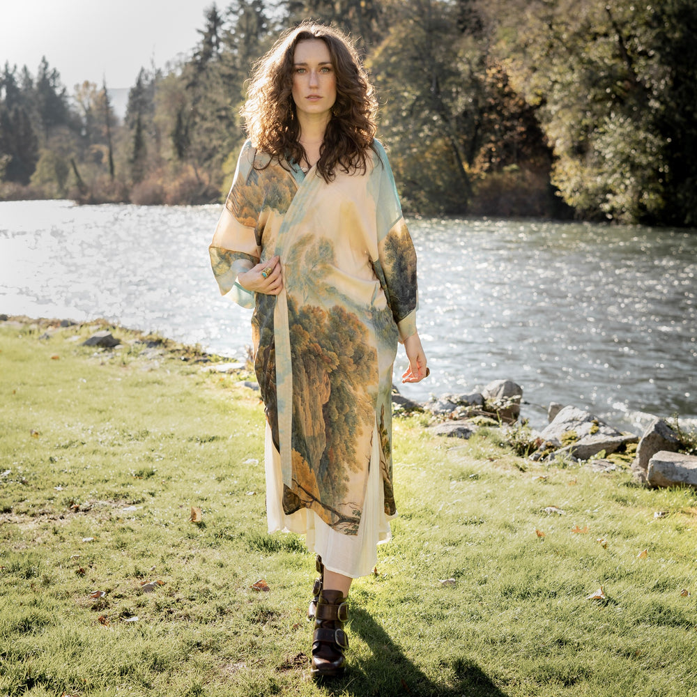 
                  
                    Romantic kimono featuring 18th-century Tivoli waterfalls and Lady Liberty art in a soft, painterly palette celebrating strength and self-love – Market of Stars.
                  
                