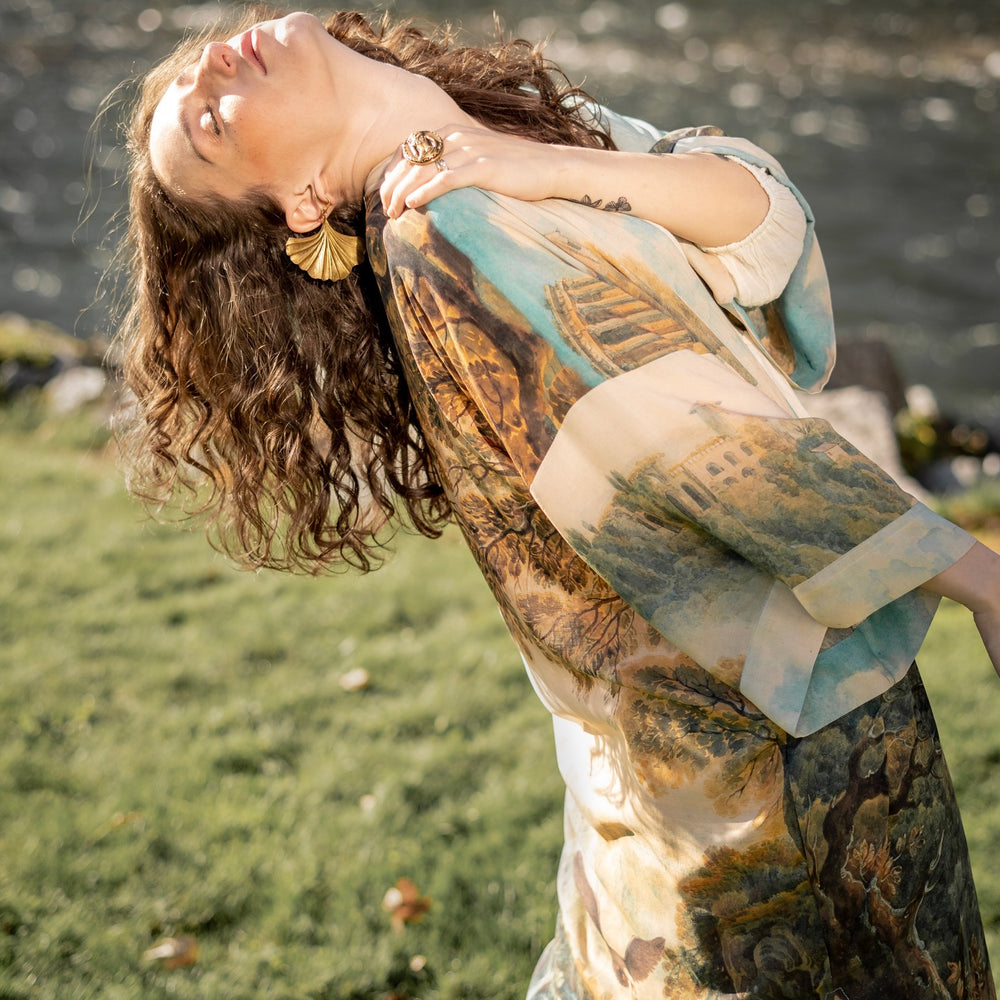 
                  
                    Romantic kimono featuring 18th-century Tivoli waterfalls and Lady Liberty art in a soft, painterly palette celebrating strength and self-love – Market of Stars.
                  
                