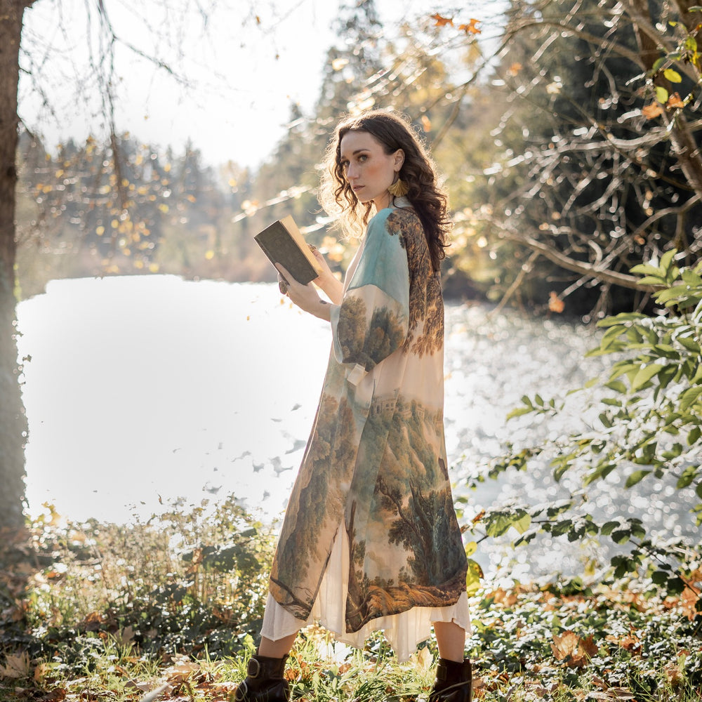 
                  
                    Romantic kimono featuring 18th-century Tivoli waterfalls and Lady Liberty art in a soft, painterly palette celebrating strength and self-love – Market of Stars.
                  
                