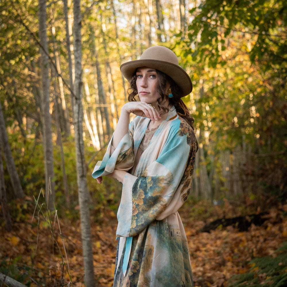 
                  
                    Romantic kimono featuring 18th-century Tivoli waterfalls and Lady Liberty art in a soft, painterly palette celebrating strength and self-love – Market of Stars.
                  
                