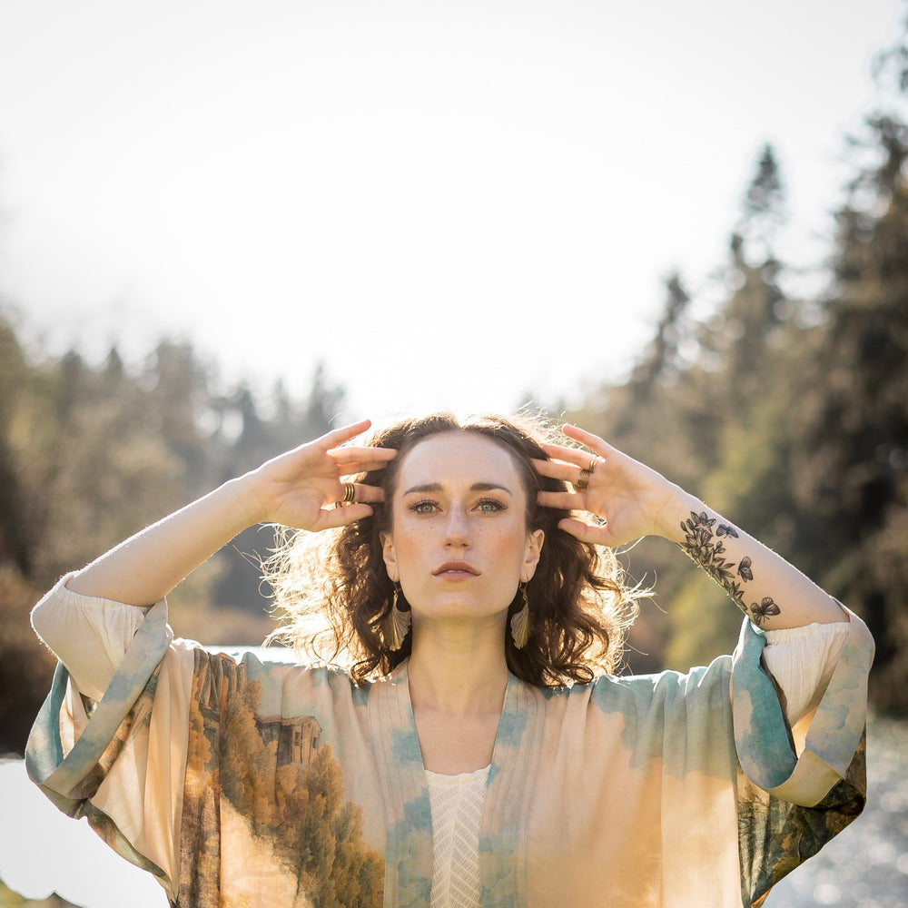 
                  
                    Romantic kimono featuring 18th-century Tivoli waterfalls and Lady Liberty art in a soft, painterly palette celebrating strength and self-love – Market of Stars.
                  
                
