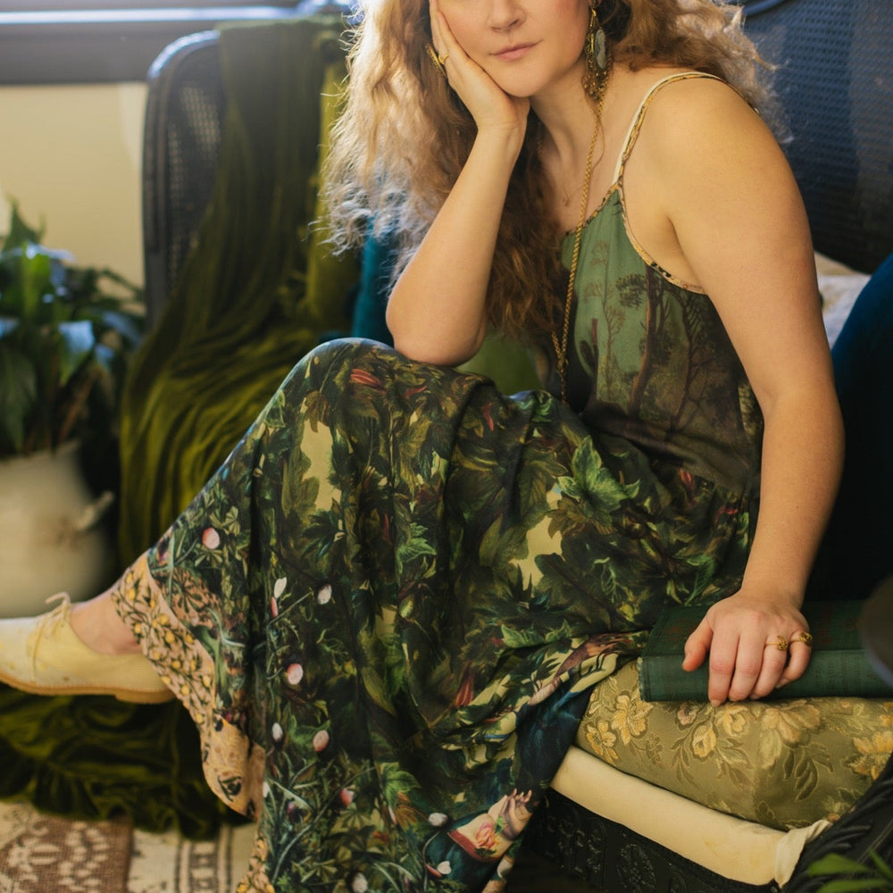 
                  
                    A romantic bamboo-based viscose slip dress featuring a moonlit river scene, a seated woman painted by Dante Gabriel Rossetti, and a hidden quote from a 1700s ring – Market of
                  
                