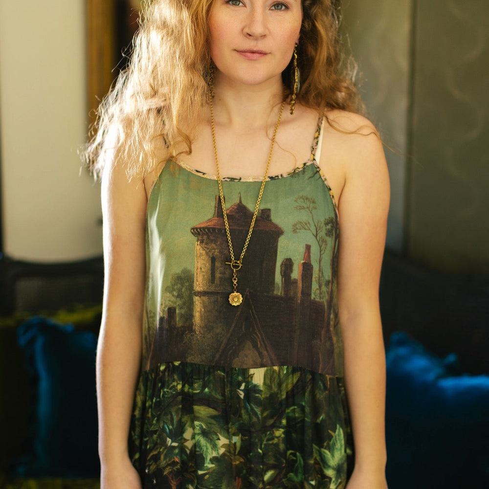 
                  
                    A romantic bamboo-based viscose slip dress featuring a moonlit river scene, a seated woman painted by Dante Gabriel Rossetti, and a hidden quote from a 1700s ring – Market of
                  
                