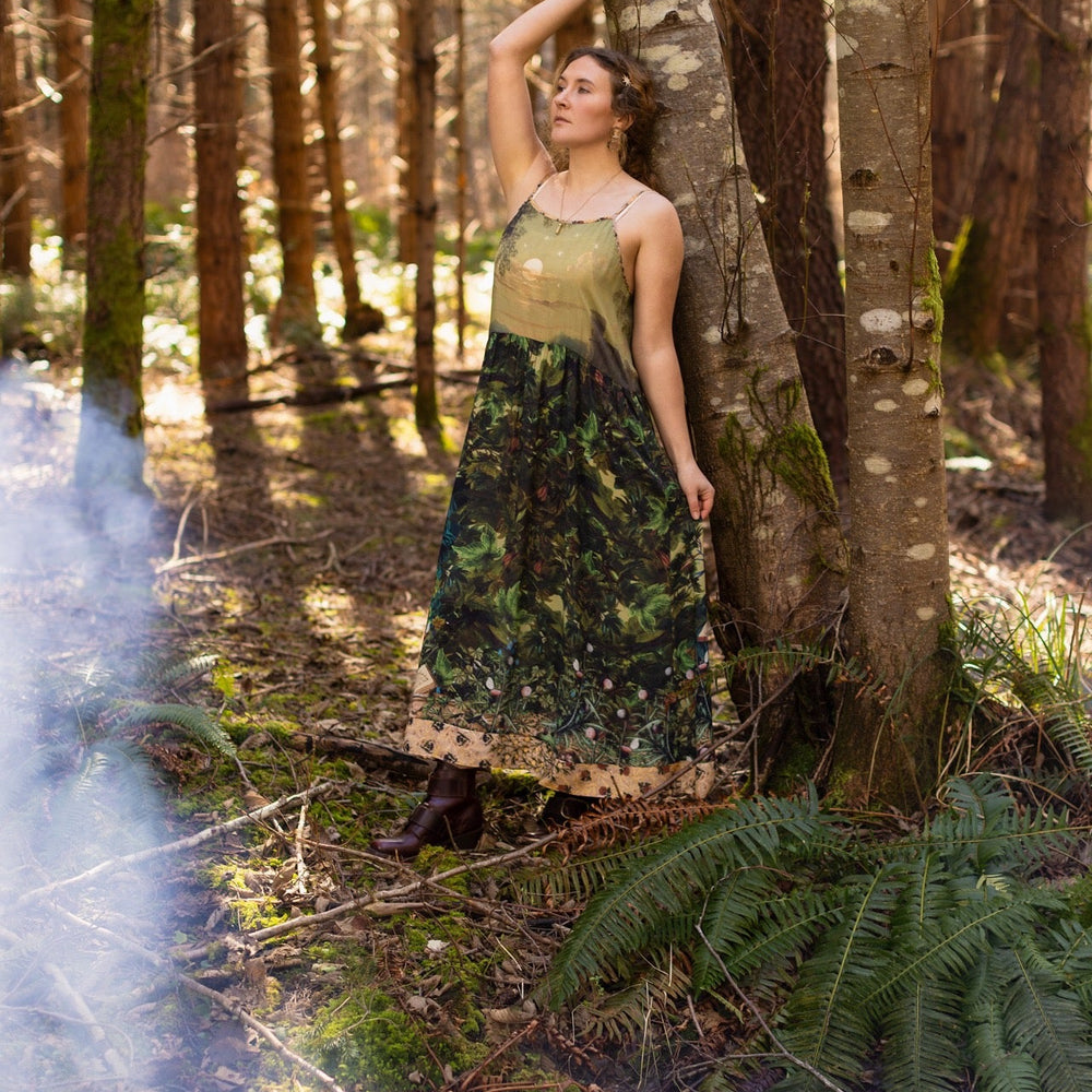 
                  
                    A romantic bamboo-based viscose slip dress featuring a moonlit river scene, a seated woman painted by Dante Gabriel Rossetti, and a hidden quote from a 1700s ring – Market of
                  
                
