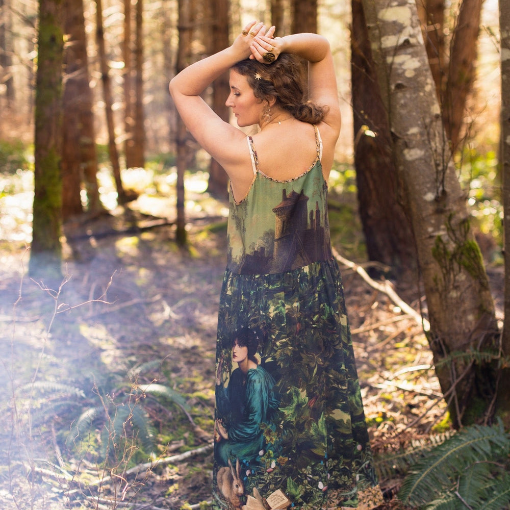 
                  
                    A romantic bamboo-based viscose slip dress featuring a moonlit river scene, a seated woman painted by Dante Gabriel Rossetti, and a hidden quote from a 1700s ring – Market of
                  
                