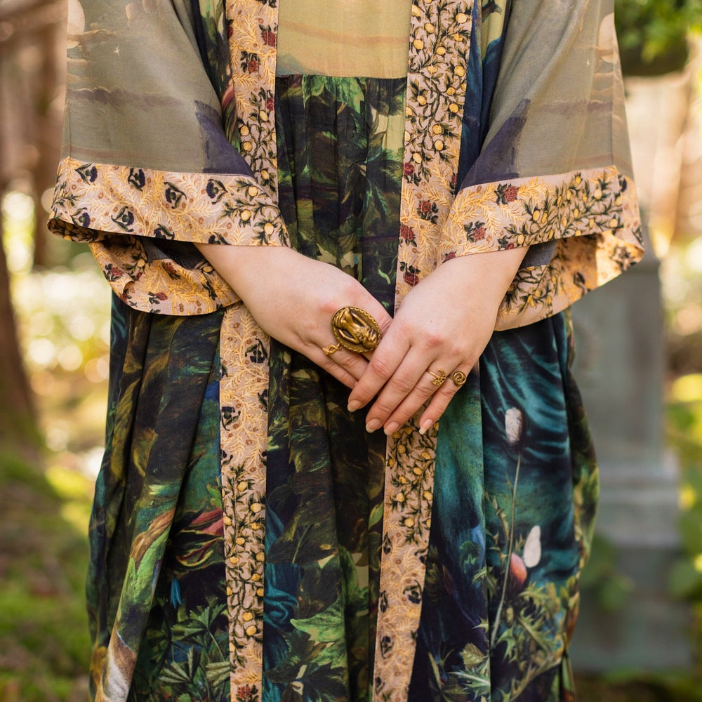 
                  
                    Romantic Bella Notte opera duster featuring Rossetti’s muse, a 16th-century rabbit, moonlit landscapes, and floral trim by William Morris – Market of Stars.
                  
                