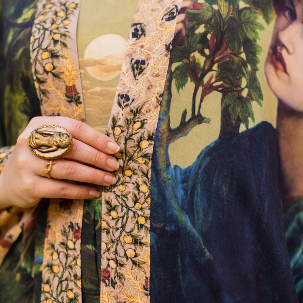 
                  
                    Romantic Bella Notte opera duster featuring Rossetti’s muse, a 16th-century rabbit, moonlit landscapes, and floral trim by William Morris – Market of Stars.
                  
                