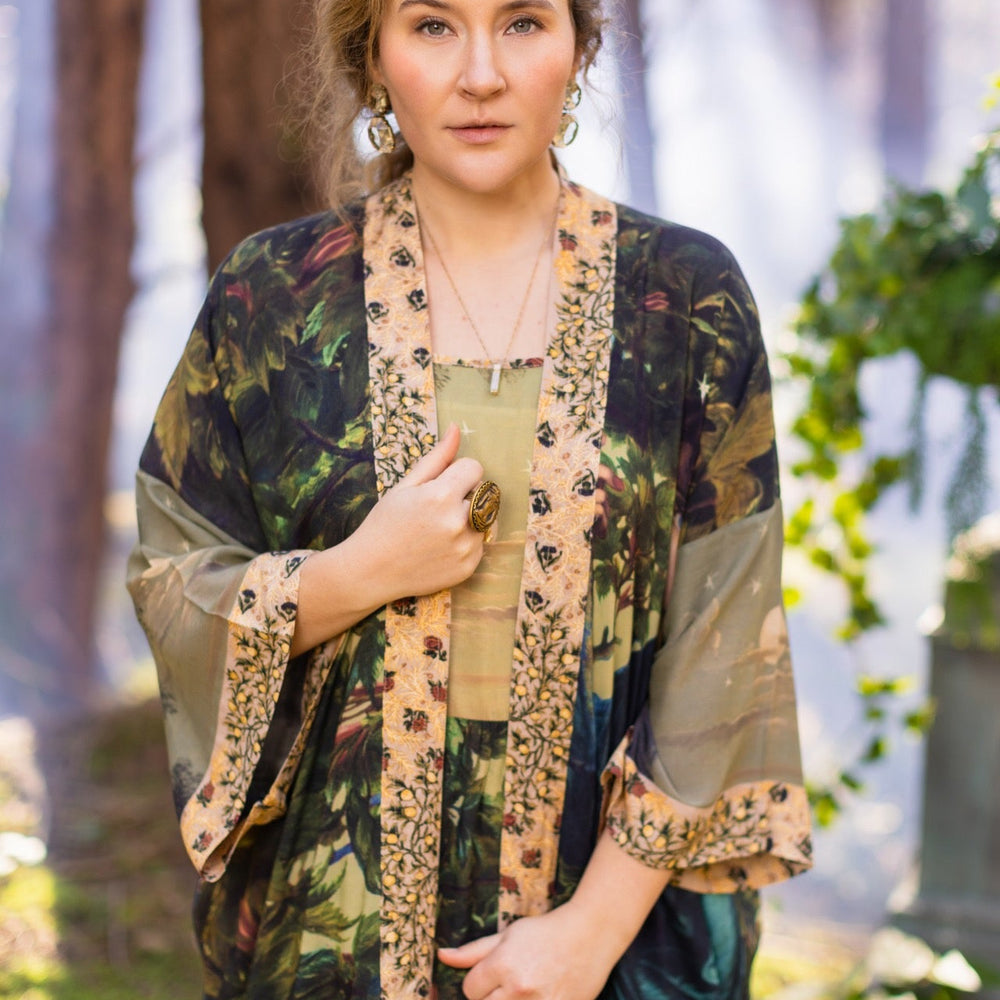 
                  
                    Romantic Bella Notte opera duster featuring Rossetti’s muse, a 16th-century rabbit, moonlit landscapes, and floral trim by William Morris – Market of Stars.
                  
                