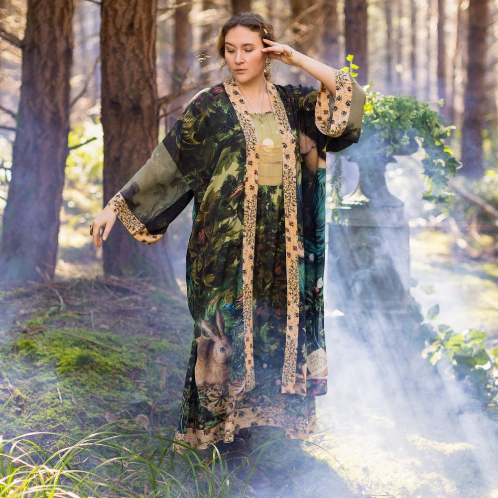 
                  
                    Romantic Bella Notte opera duster featuring Rossetti’s muse, a 16th-century rabbit, moonlit landscapes, and floral trim by William Morris – Market of Stars.
                  
                