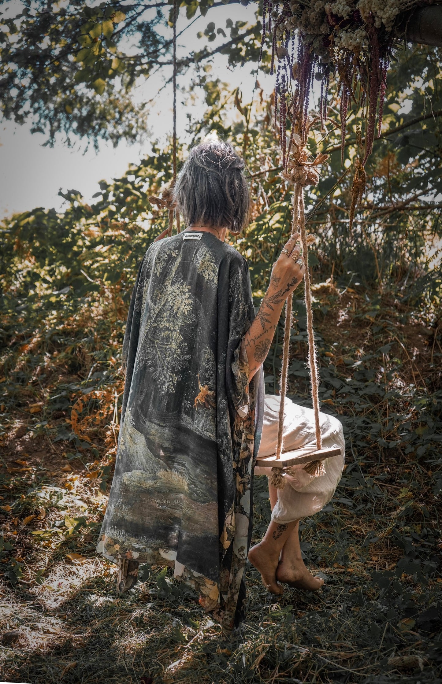 Castles in the Air Starduster kimono featuring Brueghel’s 1600s landscape, classical ruins, and joyful swing scene on bamboo-based viscose – Market of Stars.