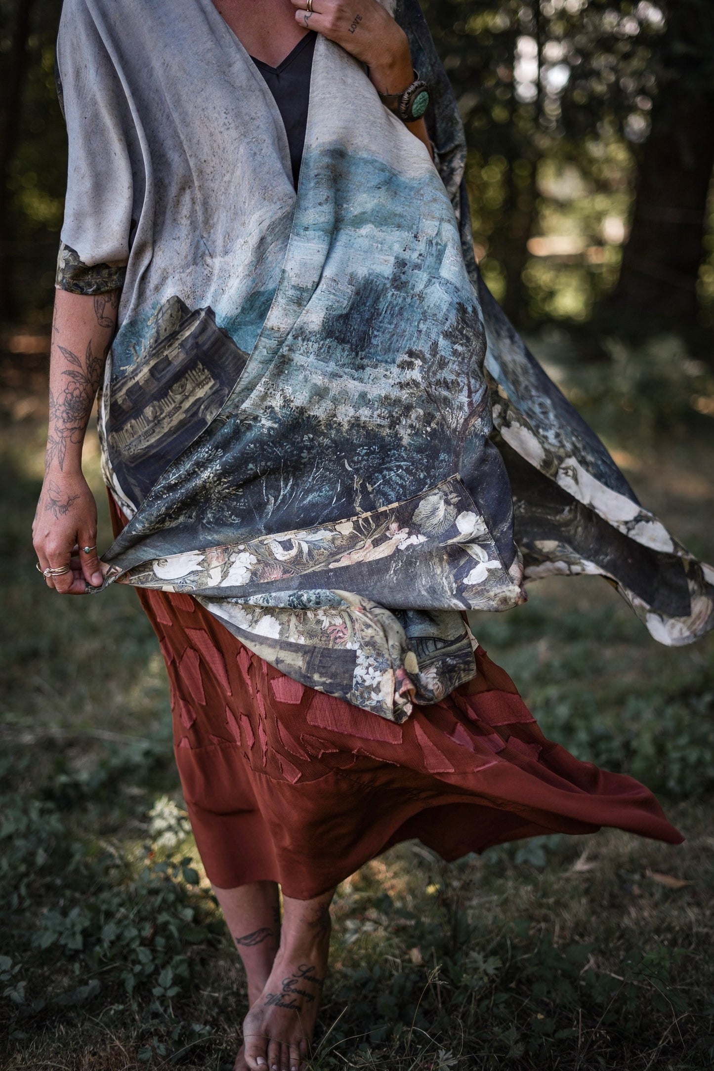 Castles in the Air Starduster kimono featuring Brueghel’s 1600s landscape, classical ruins, and joyful swing scene on bamboo-based viscose – Market of Stars.
