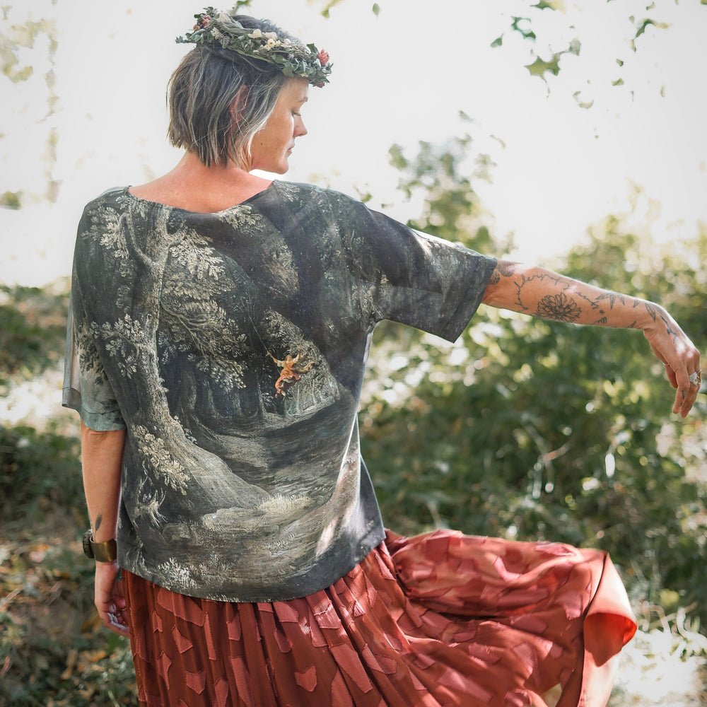 Castles in the Air Luxe Tee featuring Jan Brueghel’s whimsical 1600s landscape and painterly floral trim on soft bamboo-based viscose – Market of Stars.