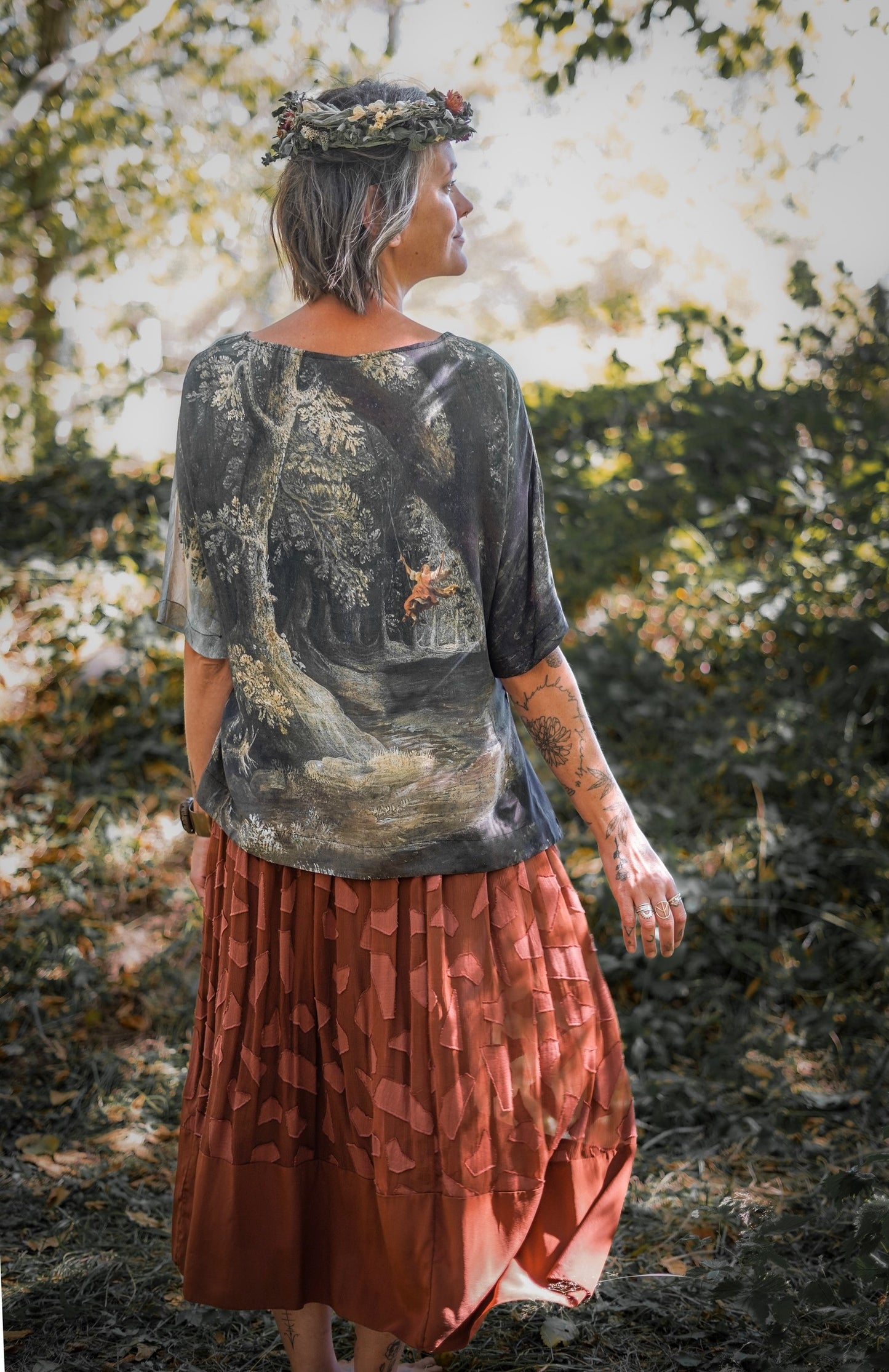 Castles in the Air Luxe Tee featuring Jan Brueghel’s whimsical 1600s landscape and painterly floral trim on soft bamboo-based viscose – Market of Stars.