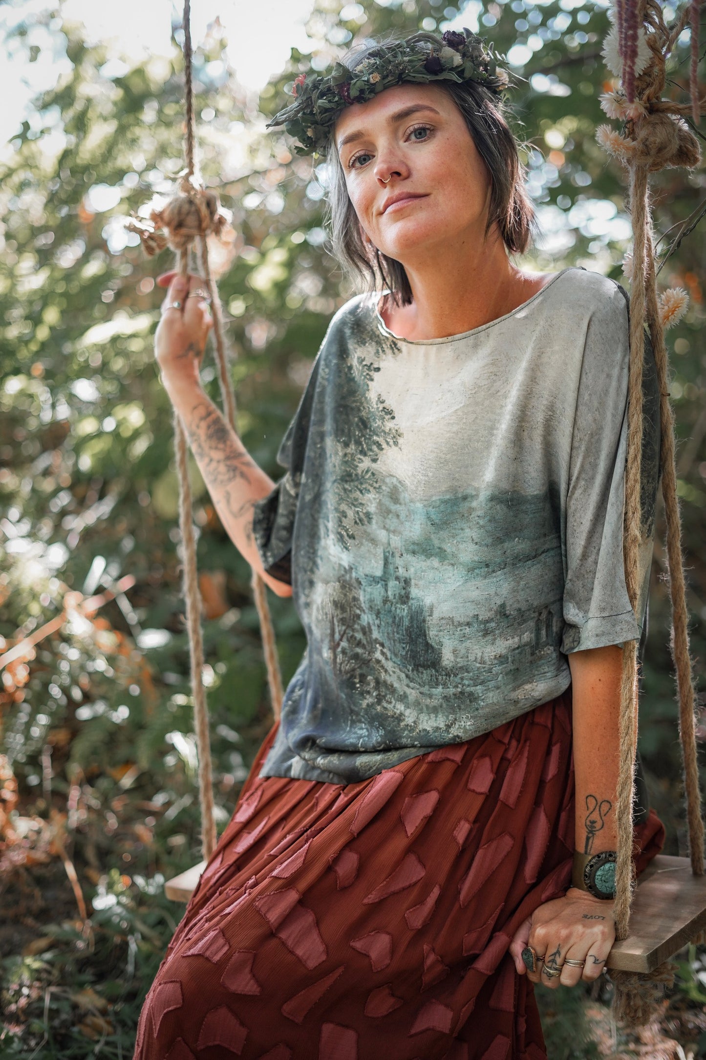 Castles in the Air Luxe Tee featuring Jan Brueghel’s whimsical 1600s landscape and painterly floral trim on soft bamboo-based viscose – Market of Stars.