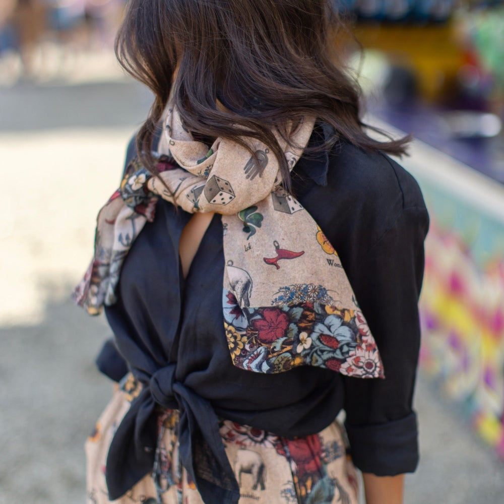 
                  
                    Charmed Life Scarf featuring whimsical Victorian good luck symbols and floral trim on soft, airy bamboo & wood viscose fabric – Market of Stars.
                  
                