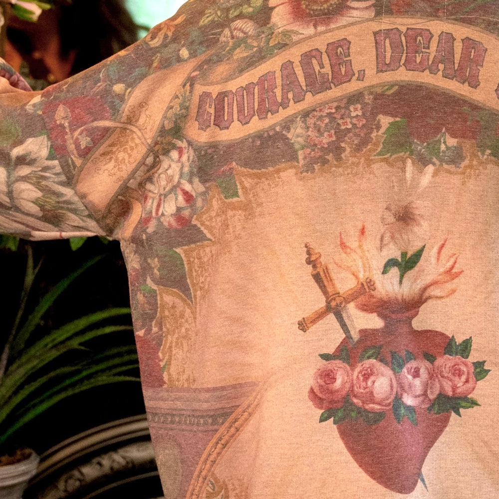 
                  
                    Cozy Courage Dear Heart Cottage Jacket featuring Victorian Sacred Heart art, hidden affirmations of courage and love, and soft fleece lining for cooler days – Market of Stars.
                  
                