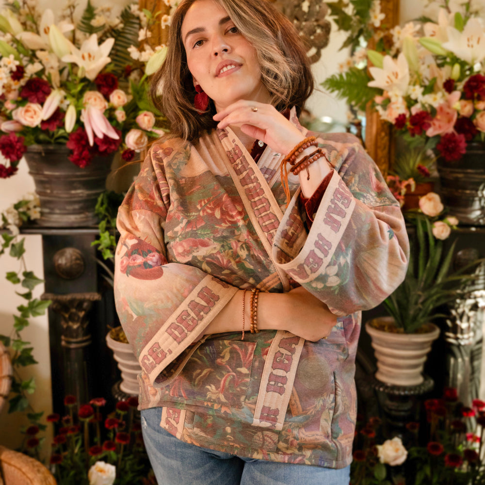 
                  
                    Cozy Courage Dear Heart Cottage Jacket featuring Victorian Sacred Heart art, hidden affirmations of courage and love, and soft fleece lining for cooler days – Market of Stars.
                  
                