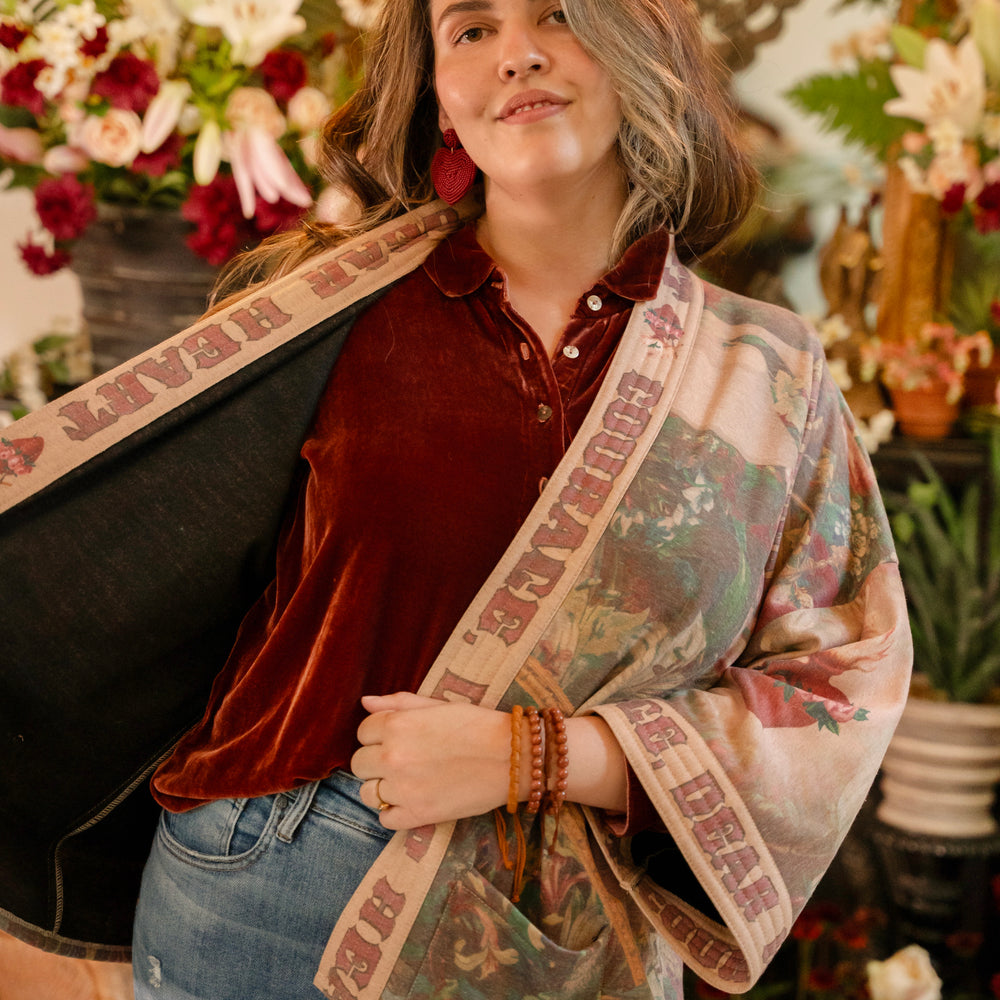 
                  
                    Cozy Courage Dear Heart Cottage Jacket featuring Victorian Sacred Heart art, hidden affirmations of courage and love, and soft fleece lining for cooler days – Market of Stars.
                  
                