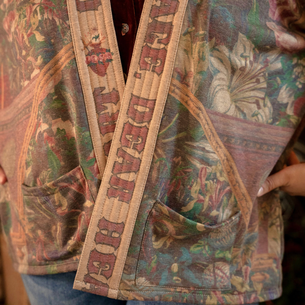 
                  
                    Cozy Courage Dear Heart Cottage Jacket featuring Victorian Sacred Heart art, hidden affirmations of courage and love, and soft fleece lining for cooler days – Market of Stars.
                  
                