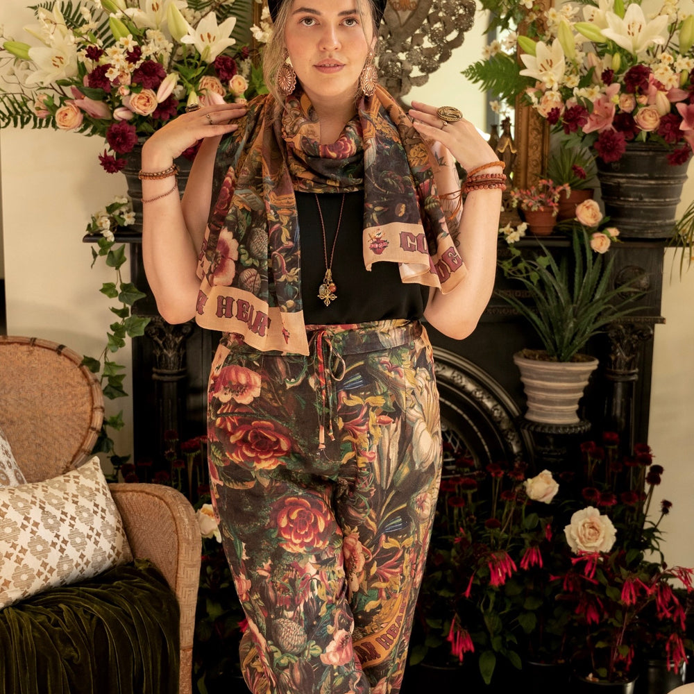 
                  
                    Artfully printed Courage Dear Heart Artist Pants with floral lithographs and hidden messages of love, faith, and courage in a breathable linen blend – Market of Stars.
                  
                