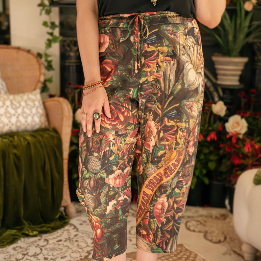 
                  
                    Artfully printed Courage Dear Heart Artist Pants with floral lithographs and hidden messages of love, faith, and courage in a breathable linen blend – Market of Stars.
                  
                