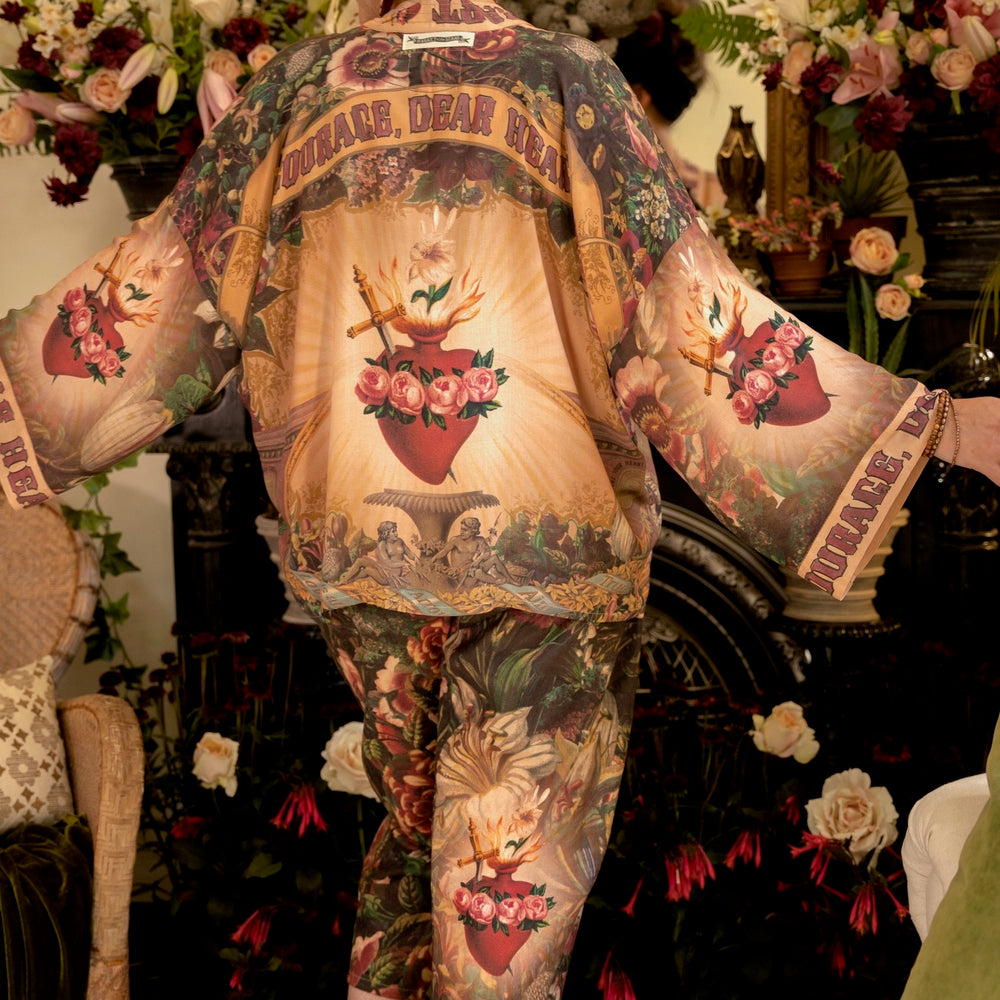 
                  
                    Artfully printed Courage Dear Heart Artist Pants with floral lithographs and hidden messages of love, faith, and courage in a breathable linen blend – Market of Stars.
                  
                