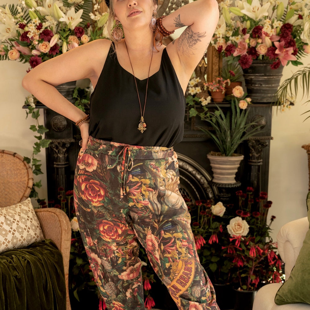 
                  
                    Artfully printed Courage Dear Heart Artist Pants with floral lithographs and hidden messages of love, faith, and courage in a breathable linen blend – Market of Stars.
                  
                