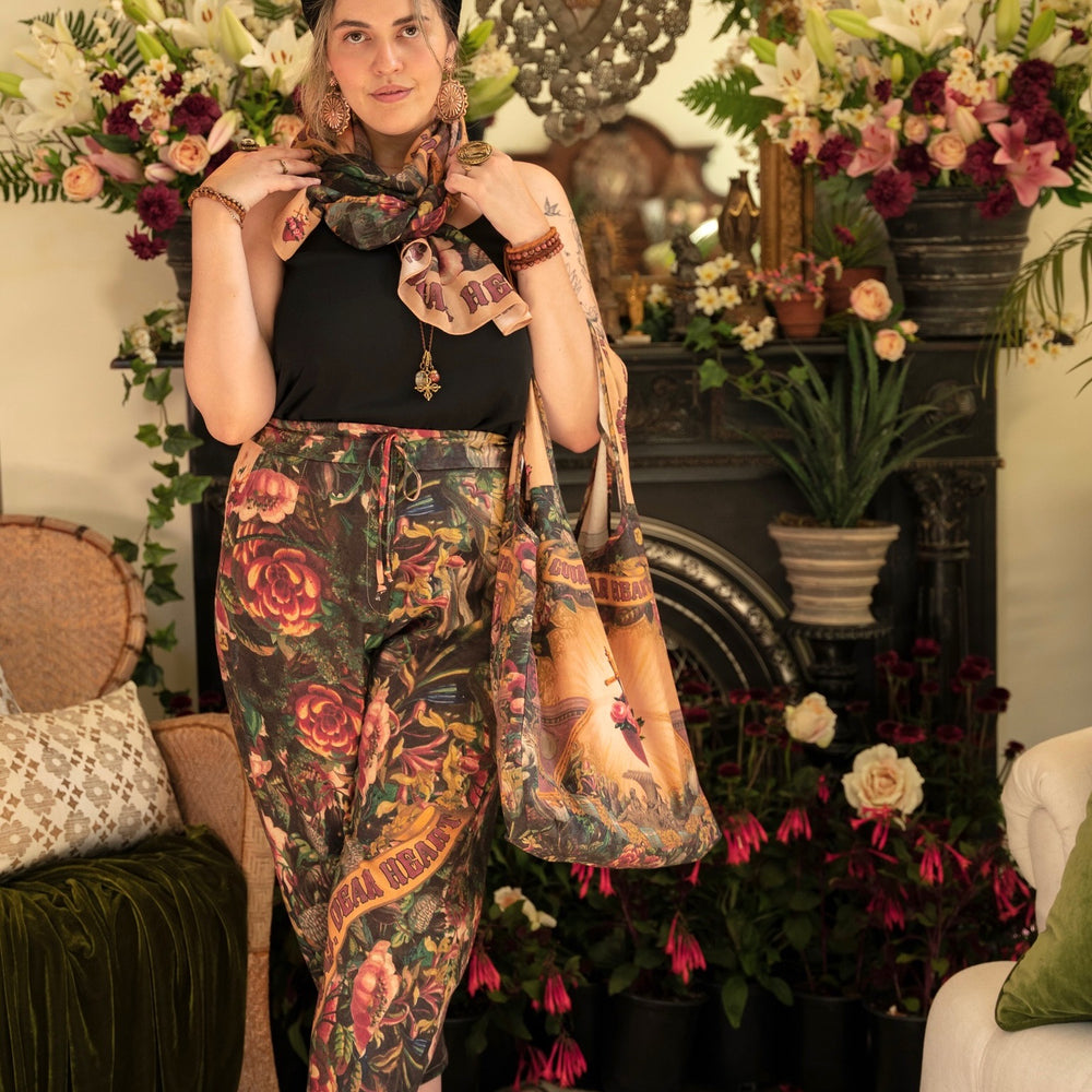 
                  
                    Artfully printed Courage Dear Heart Artist Pants with floral lithographs and hidden messages of love, faith, and courage in a breathable linen blend – Market of Stars.
                  
                