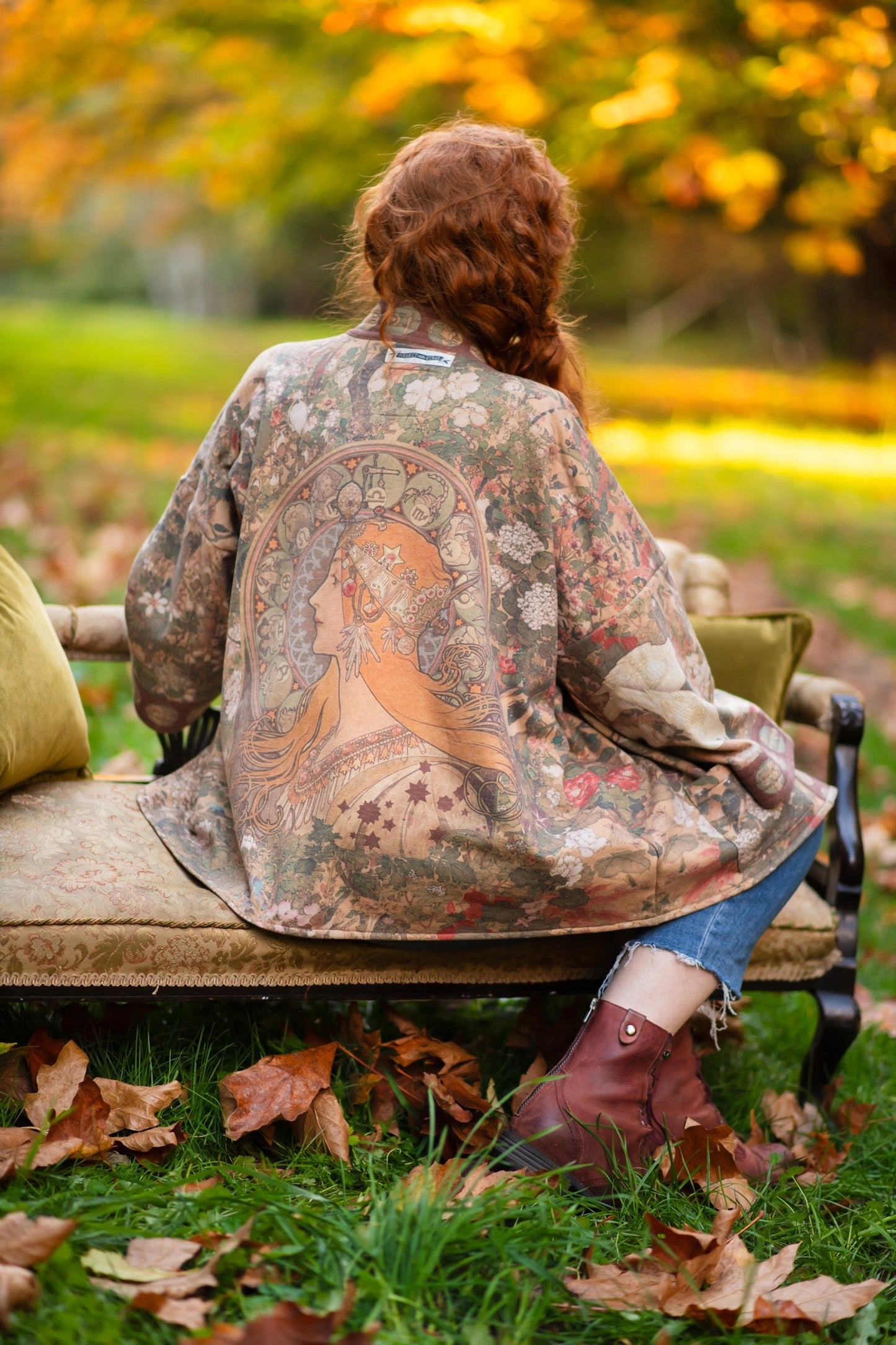 Model wearing Dreamweaver Cottage Cardigan featuring Mucha’s 1896 zodiac woman with celestial crown, printed on cozy fleece-lined cotton blend – Market of Stars