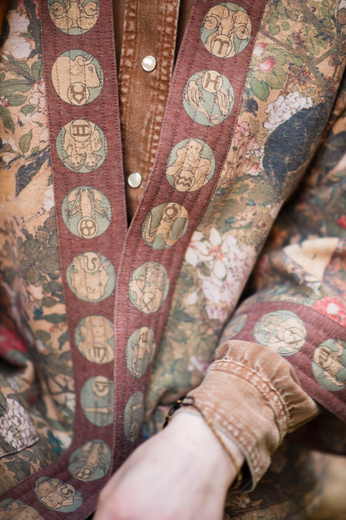 Model wearing Dreamweaver Cottage Cardigan featuring Mucha’s 1896 zodiac woman with celestial crown, printed on cozy fleece-lined cotton blend – Market of Stars