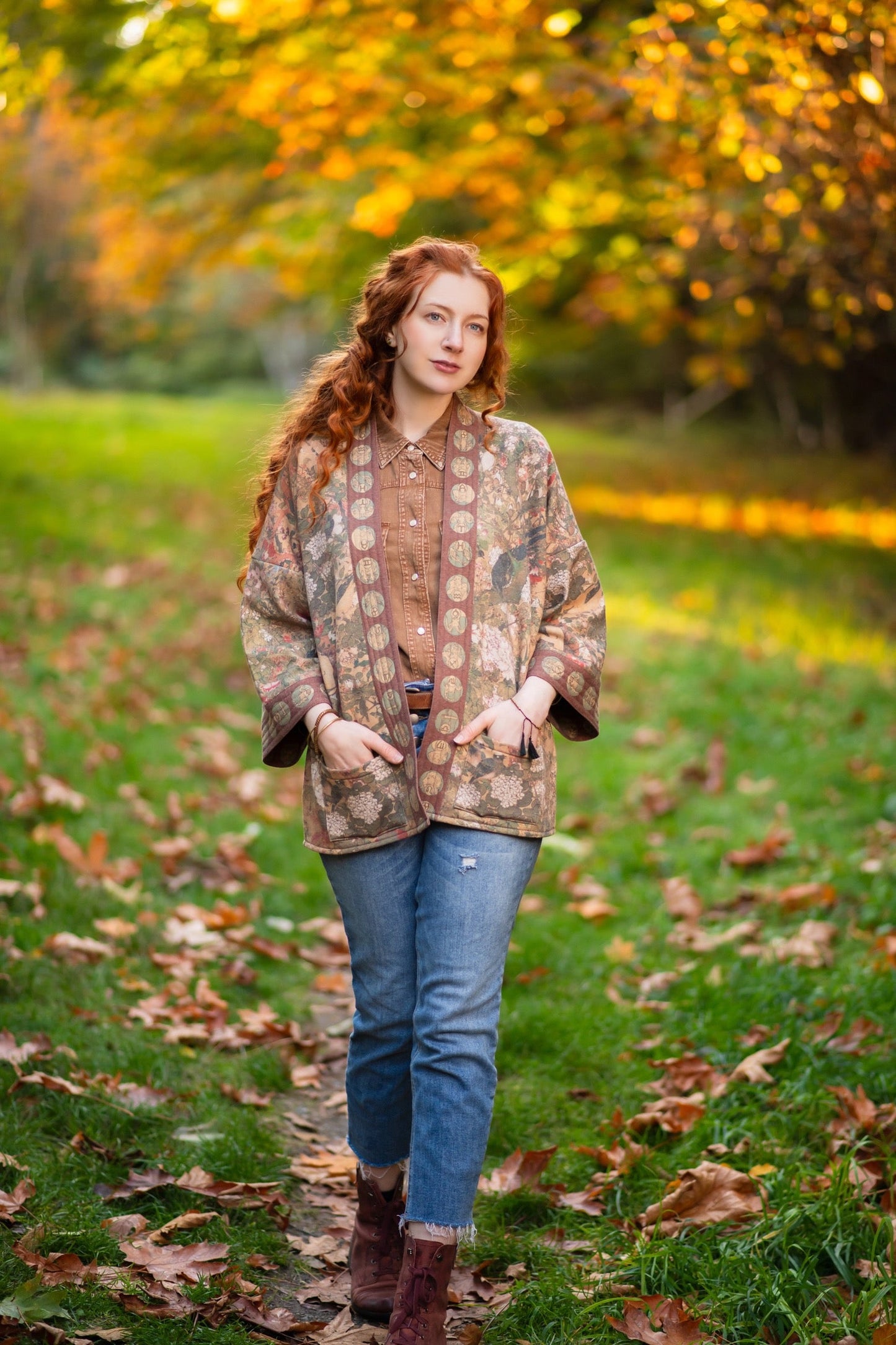Model wearing Dreamweaver Cottage Cardigan featuring Mucha’s 1896 zodiac woman with celestial crown, printed on cozy fleece-lined cotton blend – Market of Stars