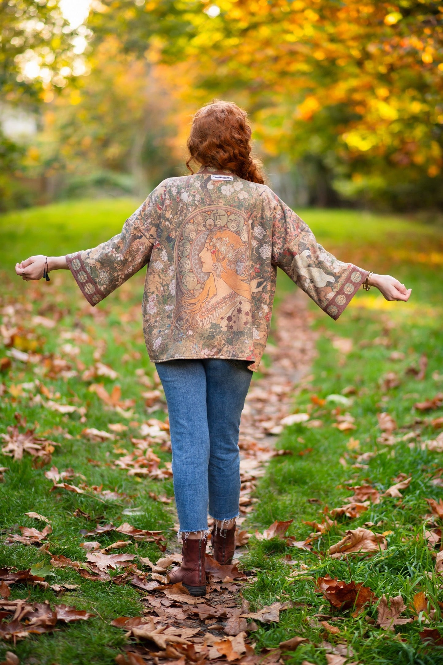 Model wearing Dreamweaver Cottage Cardigan featuring Mucha’s 1896 zodiac woman with celestial crown, printed on cozy fleece-lined cotton blend – Market of Stars