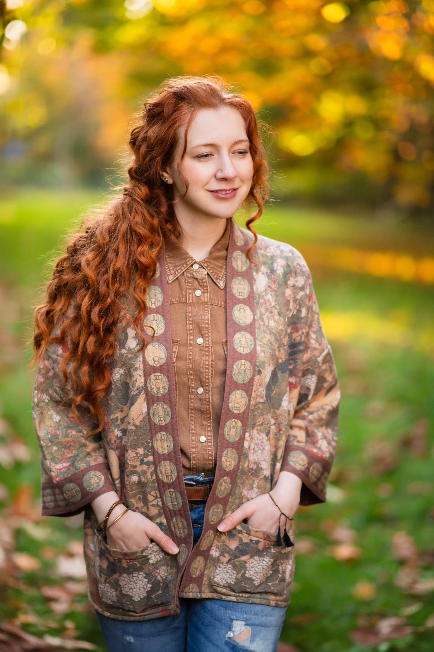 Model wearing Dreamweaver Cottage Cardigan featuring Mucha’s 1896 zodiac woman with celestial crown, printed on cozy fleece-lined cotton blend – Market of Stars