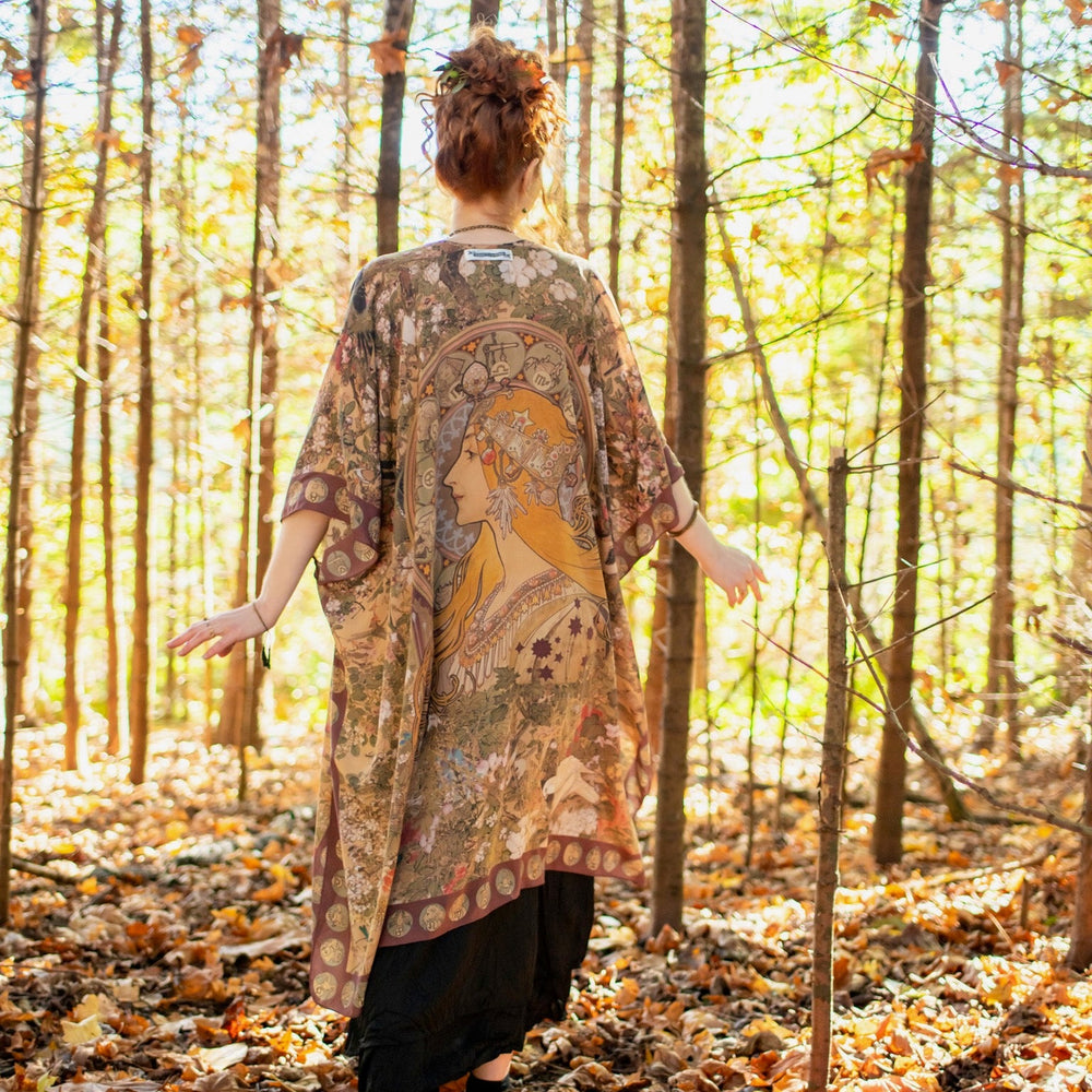 
                  
                    Dreamweaver Goddess Duster featuring Alphonse Mucha’s 1896 zodiac woman, celestial crown, and burgundy zodiac trim inspired by vintage bohemian style – Market of Stars
                  
                