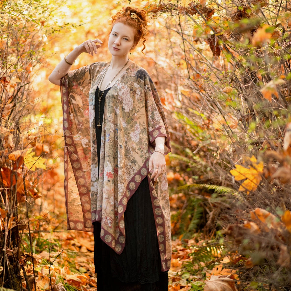 
                  
                    Dreamweaver Goddess Duster featuring Alphonse Mucha’s 1896 zodiac woman, celestial crown, and burgundy zodiac trim inspired by vintage bohemian style – Market of Stars
                  
                