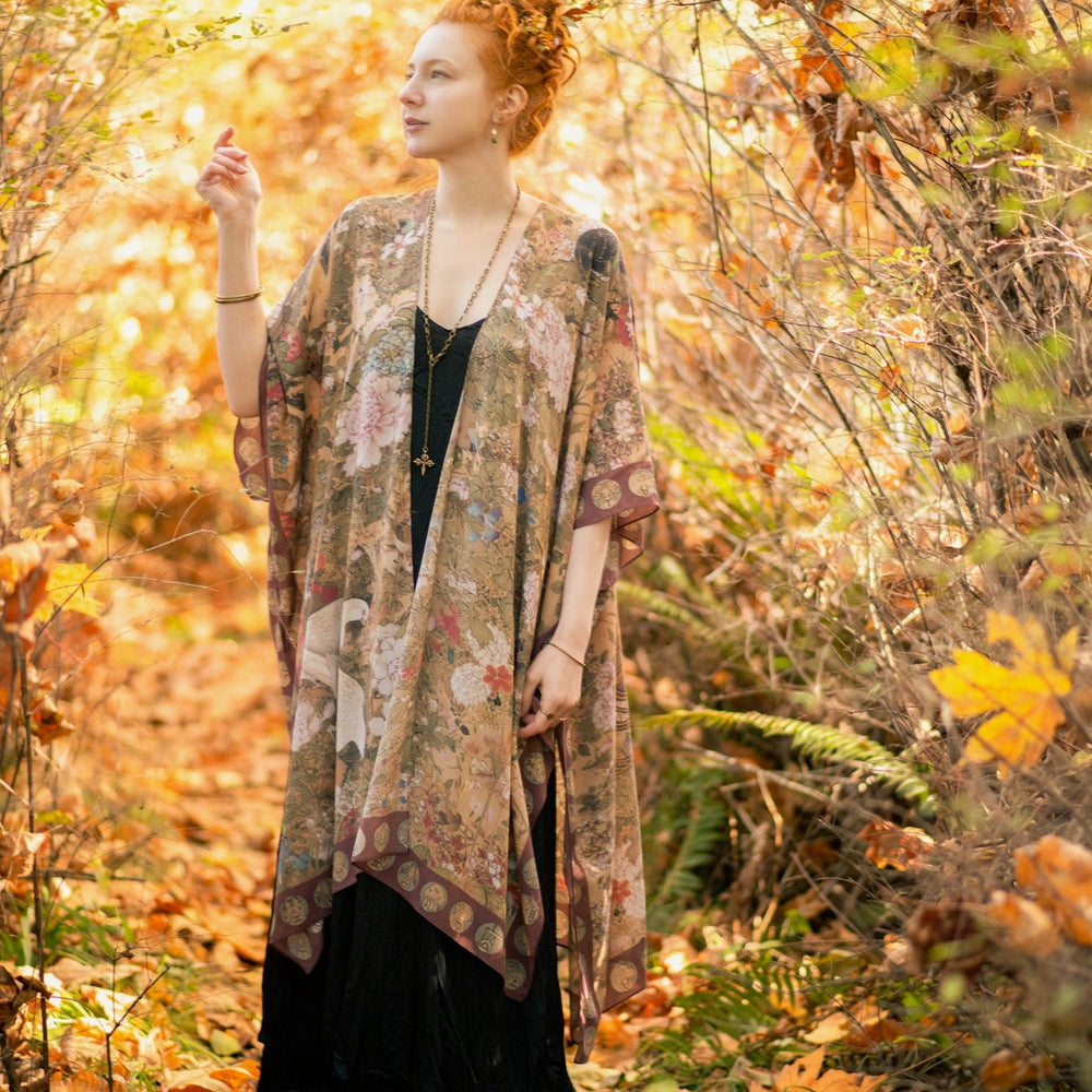 
                  
                    Dreamweaver Goddess Duster featuring Alphonse Mucha’s 1896 zodiac woman, celestial crown, and burgundy zodiac trim inspired by vintage bohemian style – Market of Stars
                  
                