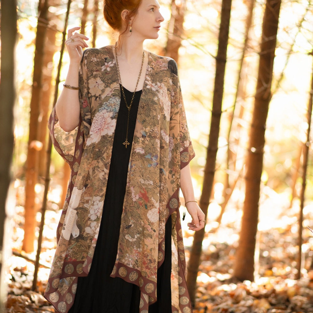 
                  
                    Dreamweaver Goddess Duster featuring Alphonse Mucha’s 1896 zodiac woman, celestial crown, and burgundy zodiac trim inspired by vintage bohemian style – Market of Stars
                  
                