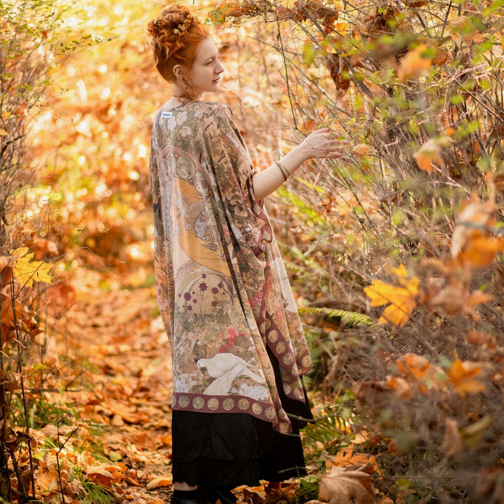 
                  
                    Dreamweaver Goddess Duster featuring Alphonse Mucha’s 1896 zodiac woman, celestial crown, and burgundy zodiac trim inspired by vintage bohemian style – Market of Stars
                  
                