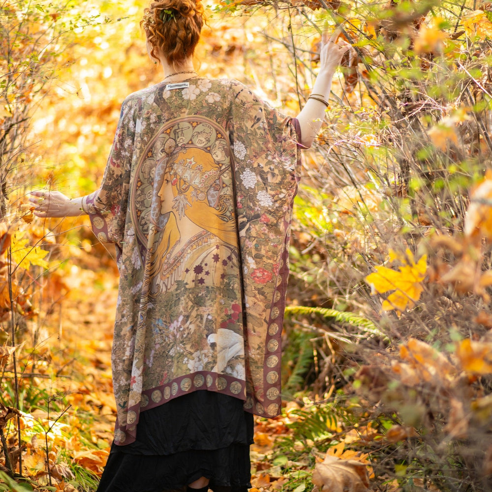 
                  
                    Dreamweaver Goddess Duster featuring Alphonse Mucha’s 1896 zodiac woman, celestial crown, and burgundy zodiac trim inspired by vintage bohemian style – Market of Stars
                  
                