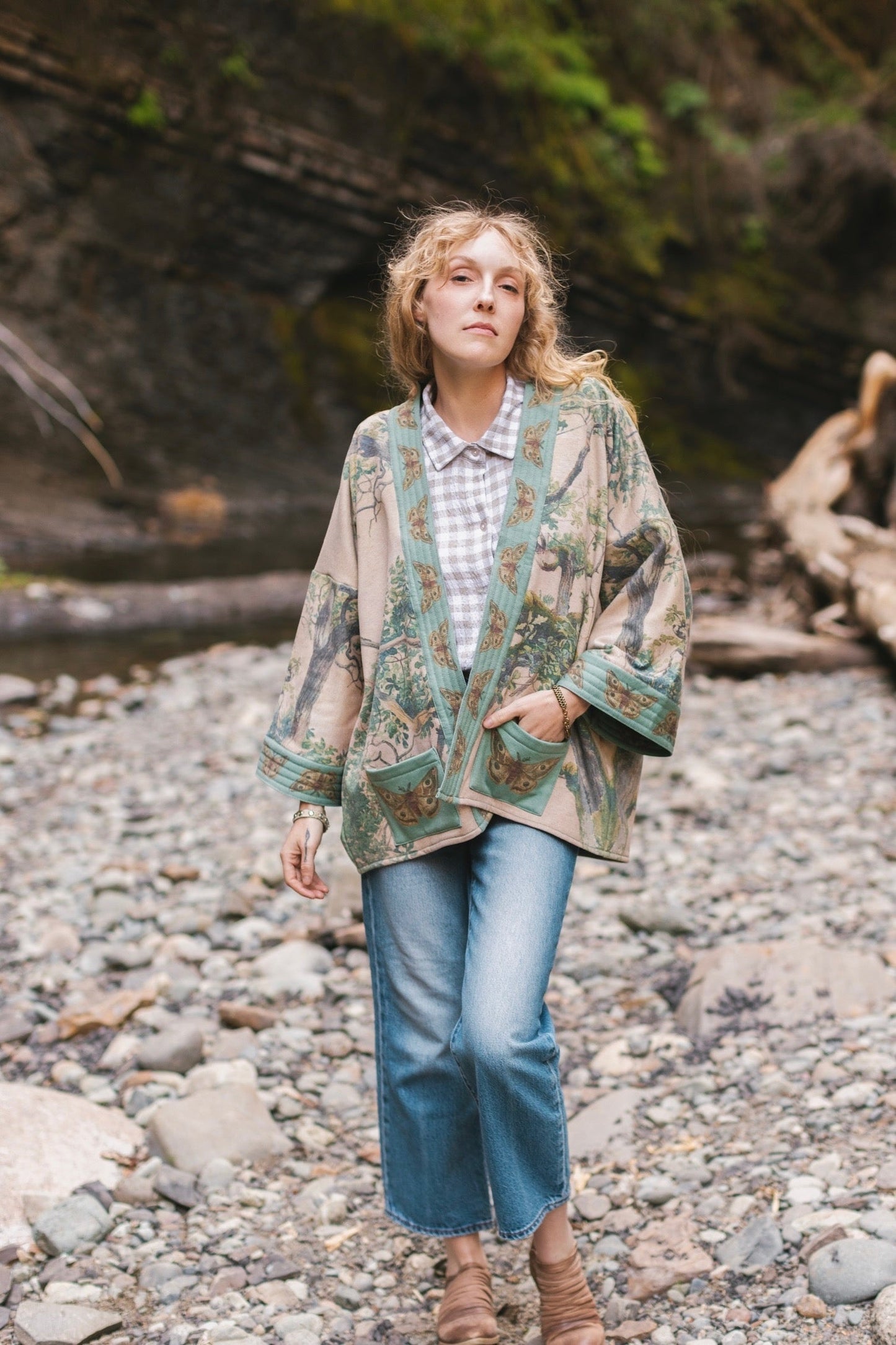 Model wearing Earth and Sky Cottage Jacket – featuring Charles Aston’s tree painting and antique moth art – cozy fleece-lined cardigan for cooler days – Market of Stars.