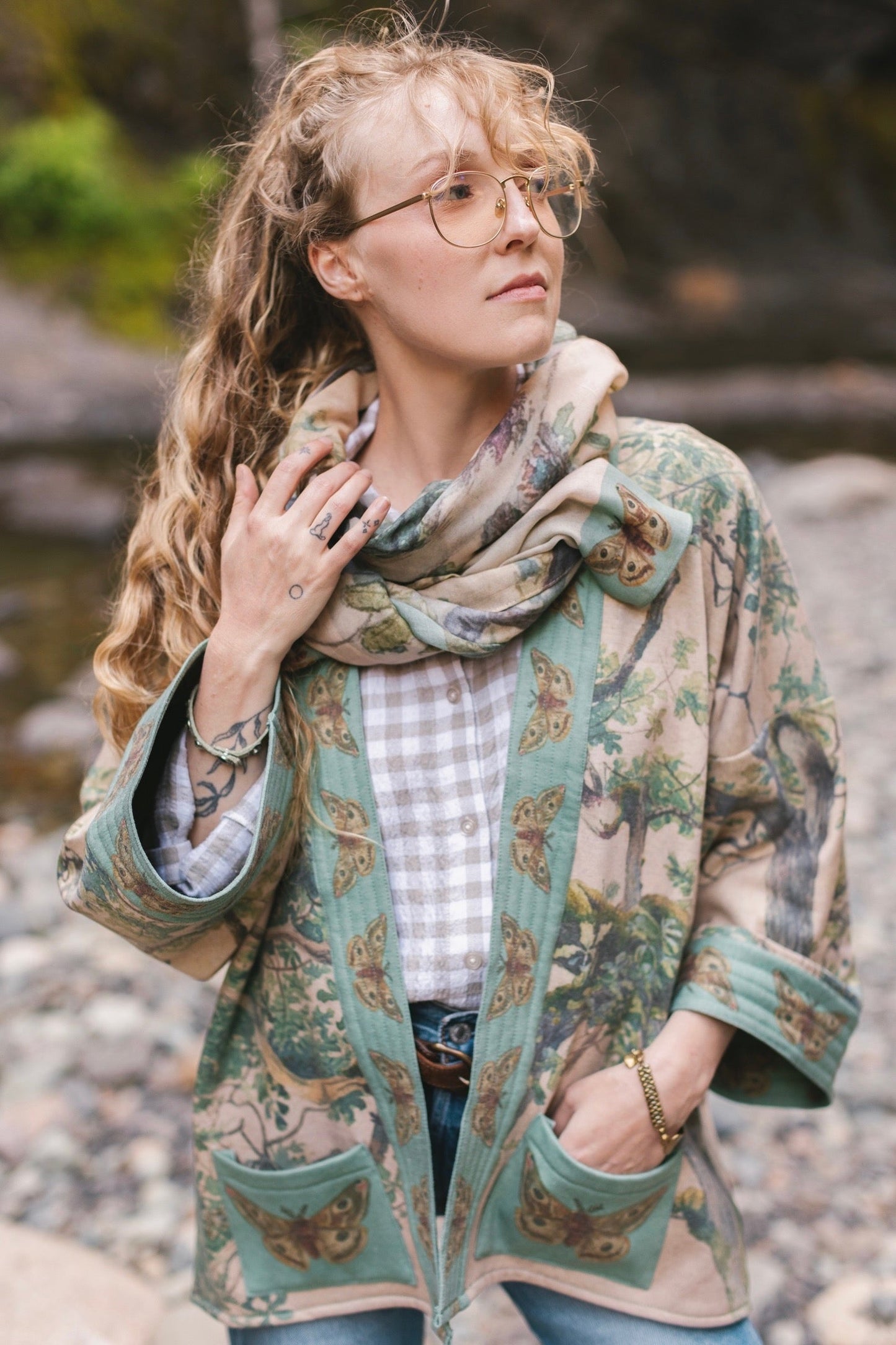 Model wearing Earth and Sky Cottage Jacket – featuring Charles Aston’s tree painting and antique moth art – cozy fleece-lined cardigan for cooler days – Market of Stars.