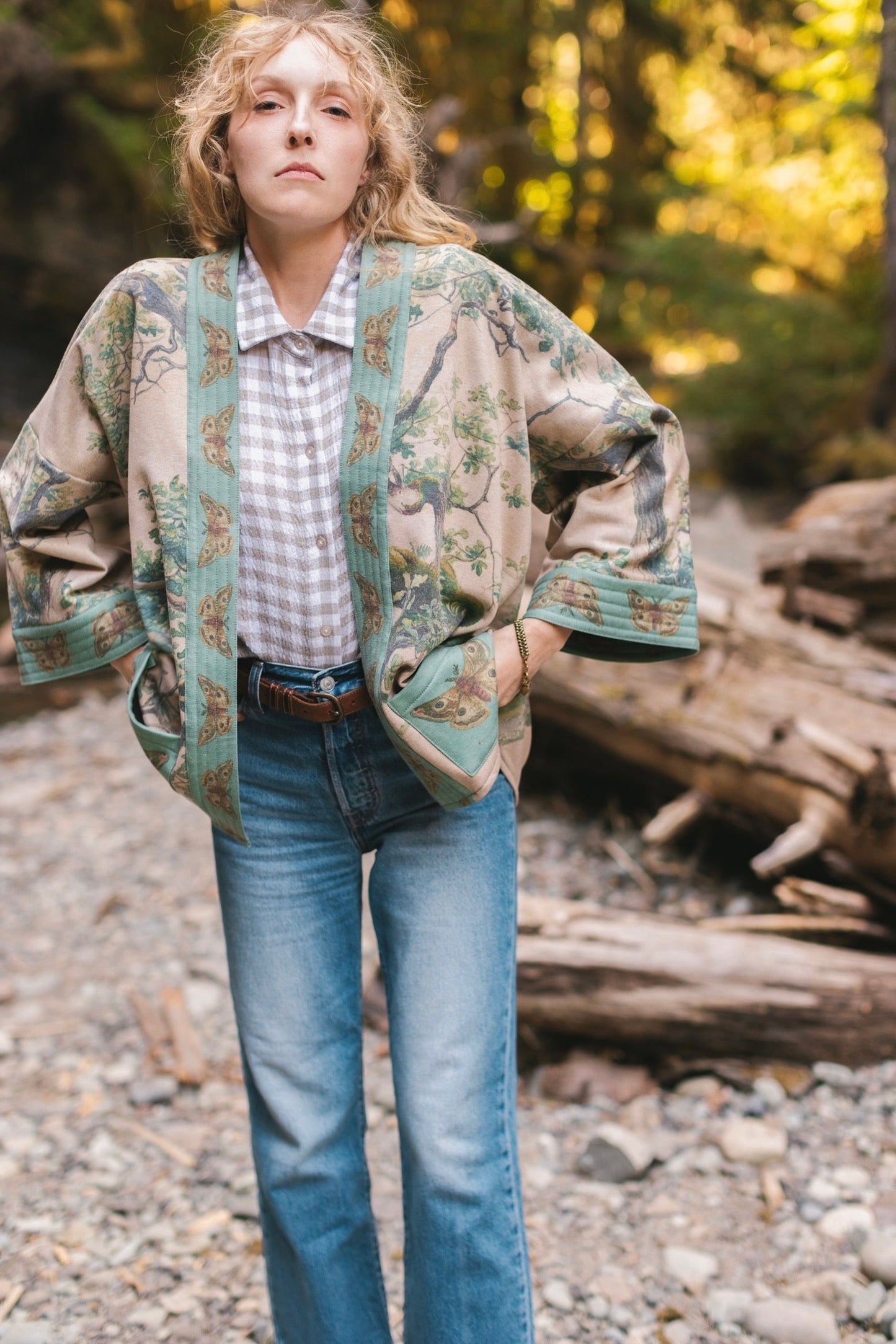 Model wearing Earth and Sky Cottage Jacket – featuring Charles Aston’s tree painting and antique moth art – cozy fleece-lined cardigan for cooler days – Market of Stars.