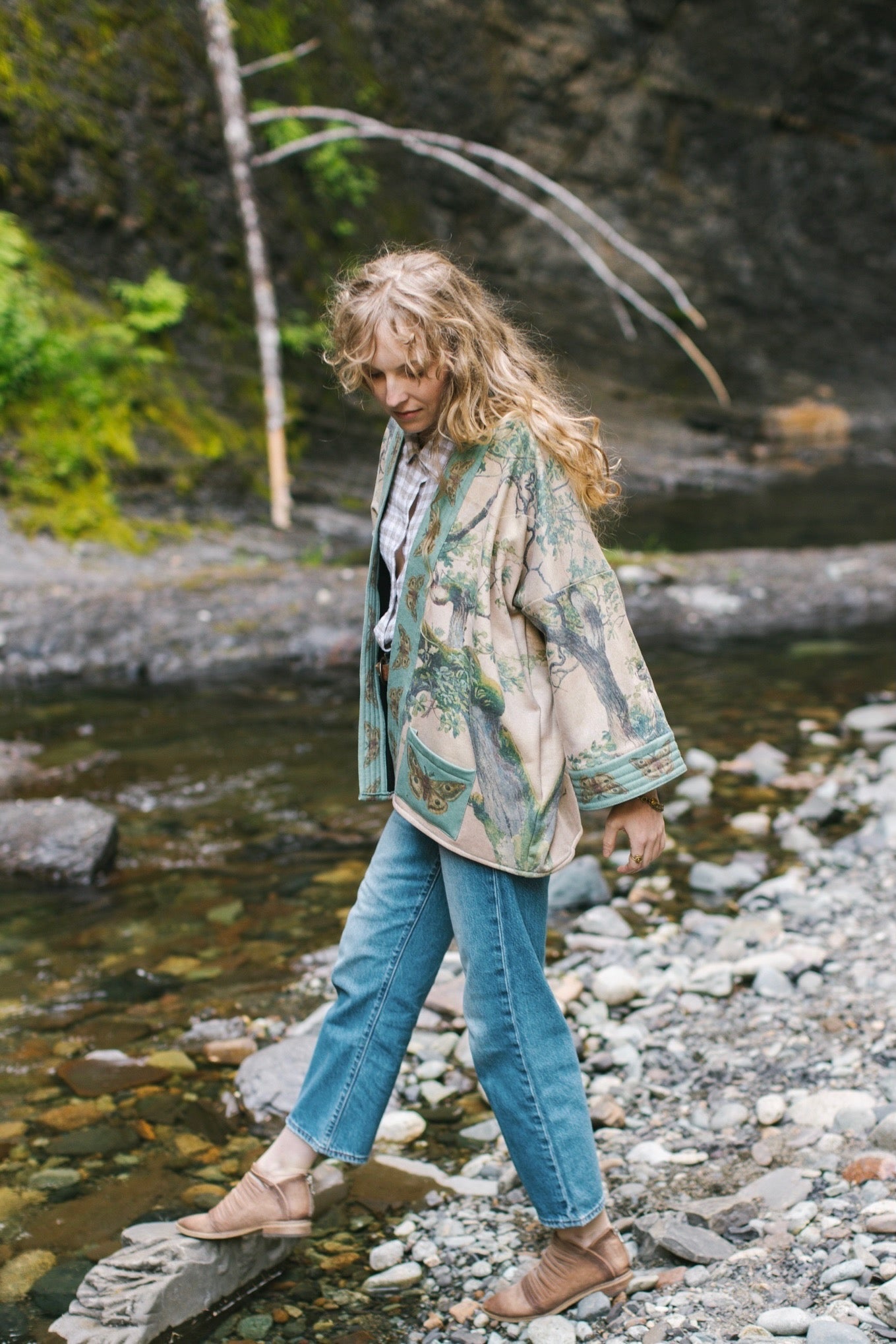 Model wearing Earth and Sky Cottage Jacket – featuring Charles Aston’s tree painting and antique moth art – cozy fleece-lined cardigan for cooler days – Market of Stars.