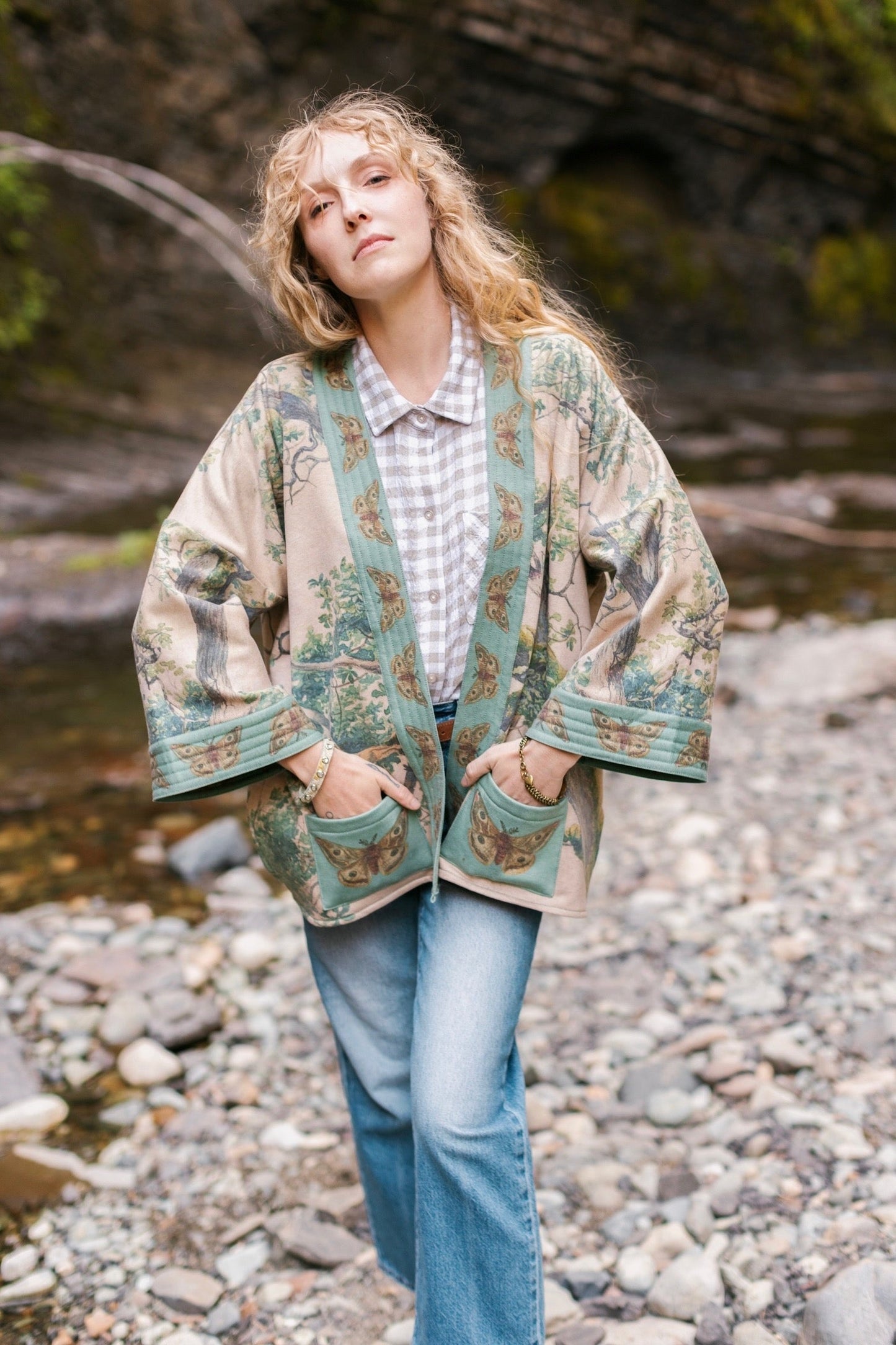 Model wearing Earth and Sky Cottage Jacket – featuring Charles Aston’s tree painting and antique moth art – cozy fleece-lined cardigan for cooler days – Market of Stars.