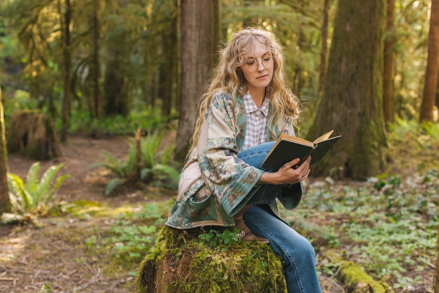 Model wearing Earth and Sky Cottage Jacket – featuring Charles Aston’s tree painting and antique moth art – cozy fleece-lined cardigan for cooler days – Market of Stars.