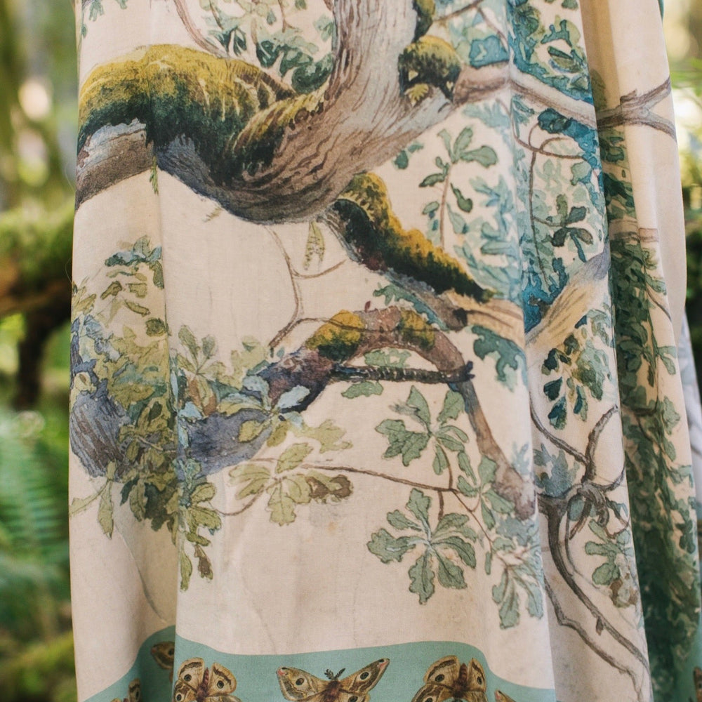 
                  
                    Model wearing the Earth and Sky Goddess length kimono featuring majestic trees by Charles Aston and antique moth illustrations – a dreamy tribute to nature – Market of Stars.
                  
                
