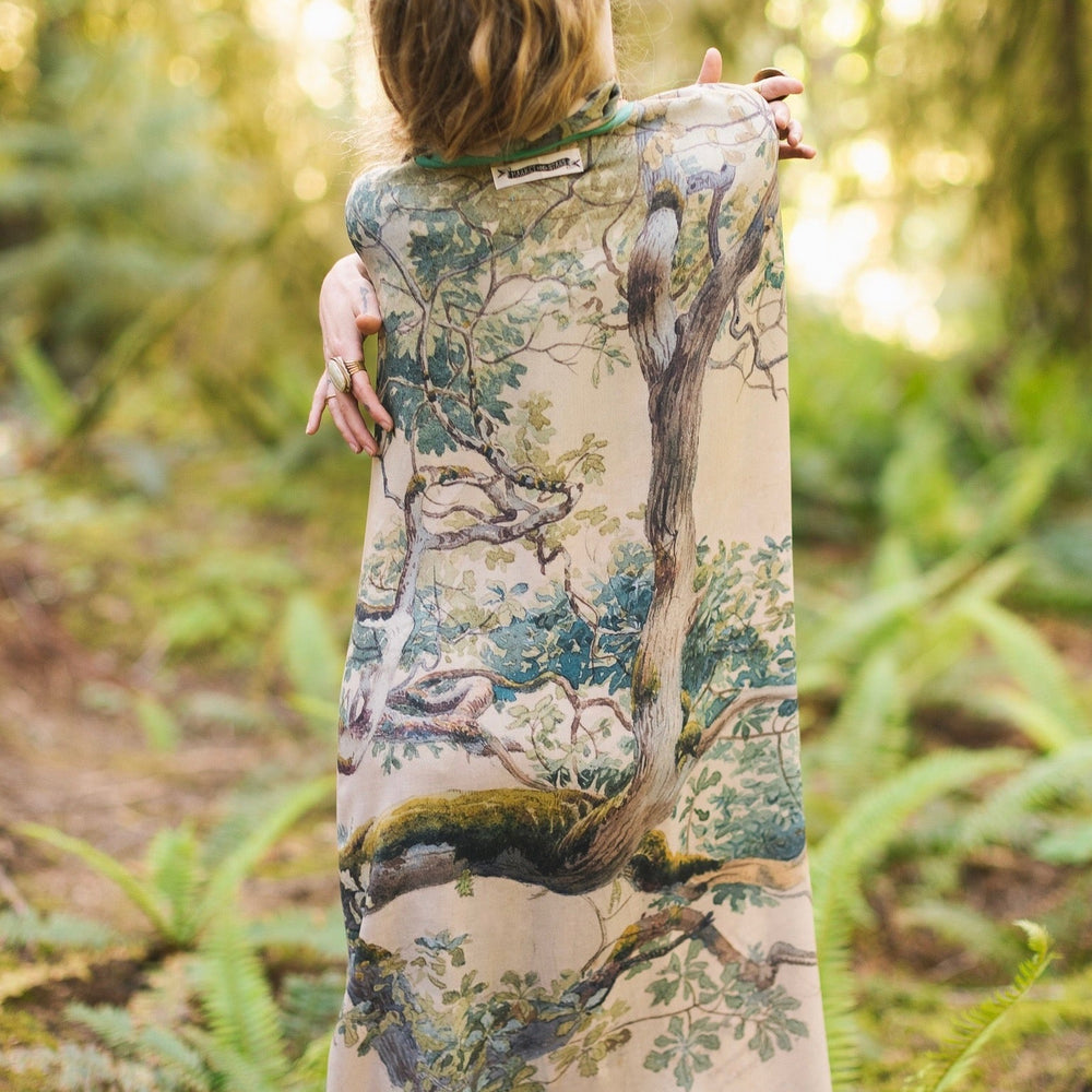 
                  
                    Model wearing the Earth and Sky Goddess length kimono featuring majestic trees by Charles Aston and antique moth illustrations – a dreamy tribute to nature – Market of Stars.
                  
                