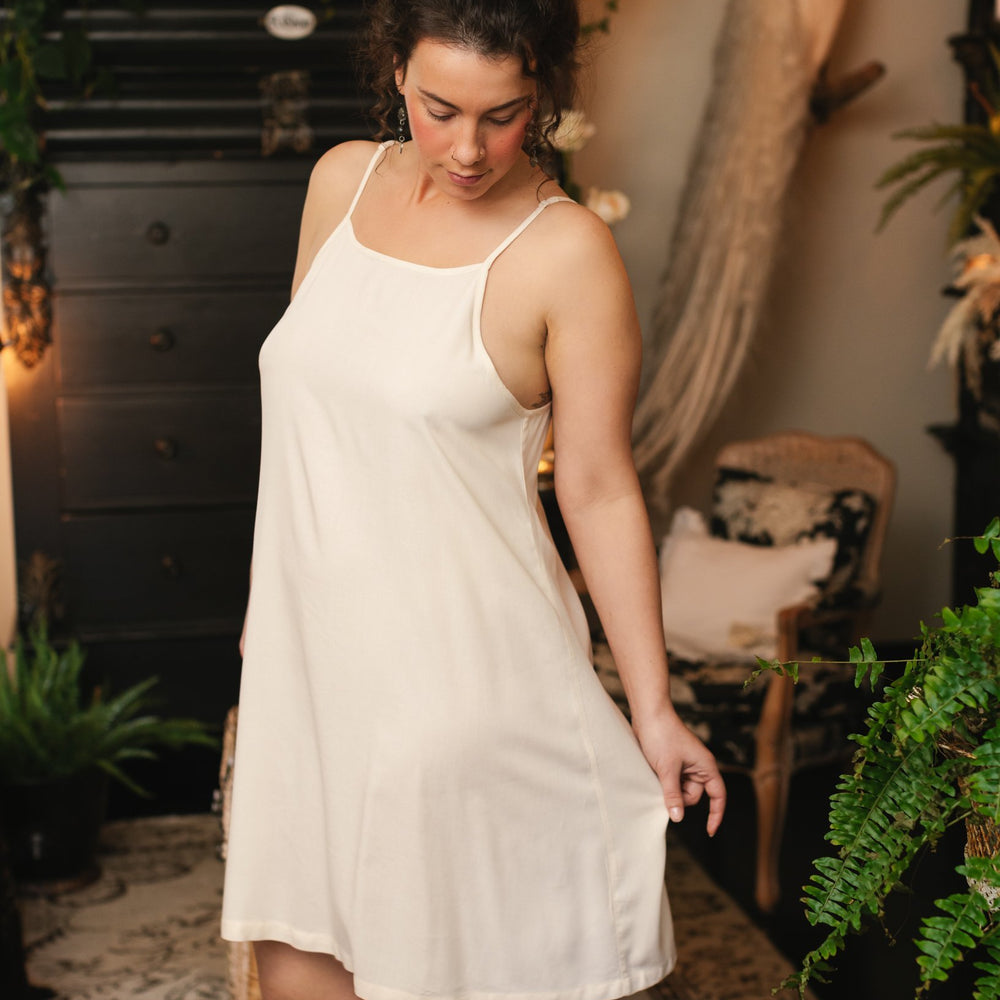 Model wearing the Étoile Simple Slip in soft natural viscose – perfect for layering under Market of Stars dresses, adding comfort and coverage – Market of Stars.